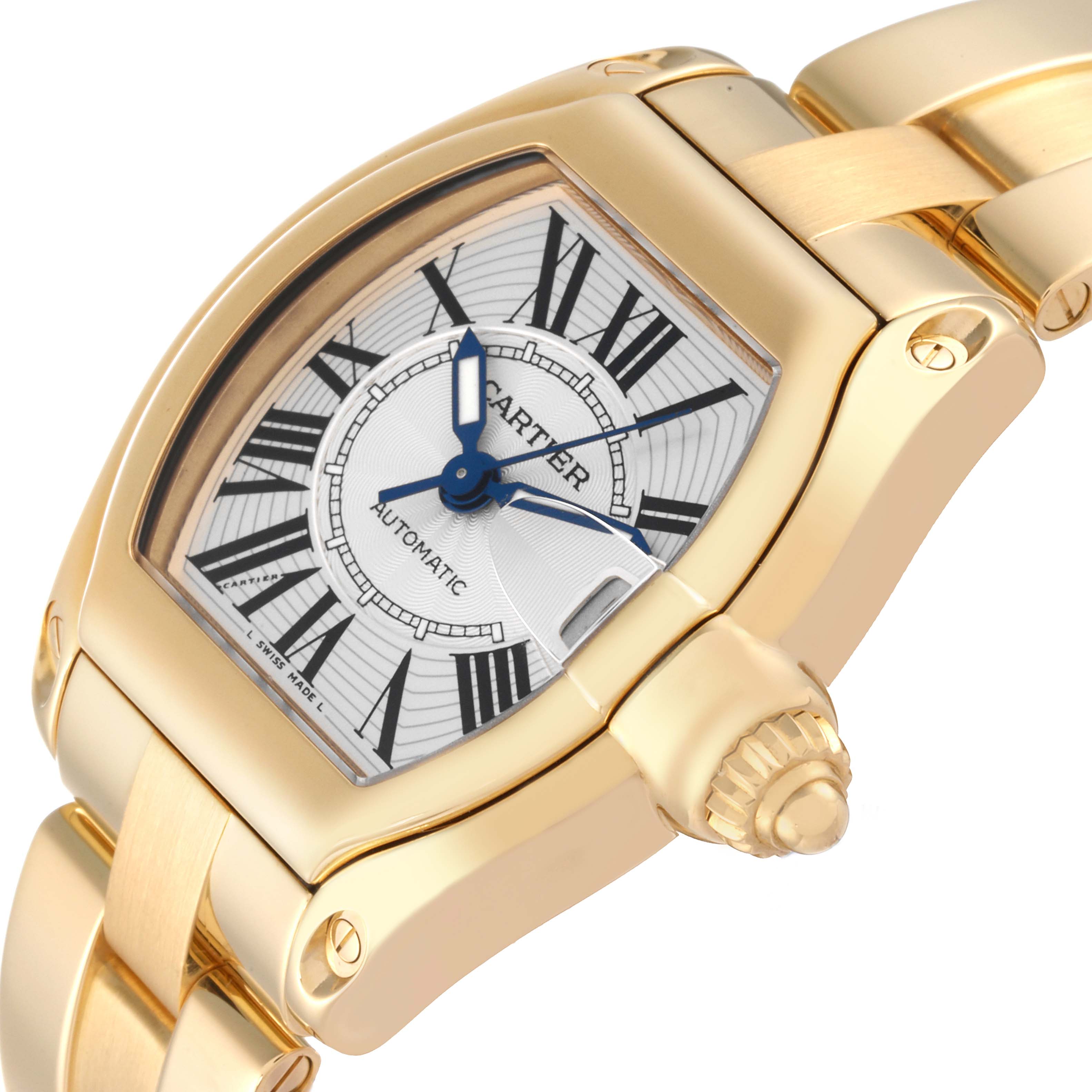 The image shows a close-up angle of a Cartier Roadster W62005V1 Men's Yellow Gold Silver Dial W62005V1 Men's Yellow Gold Silver Dial watch, highlighting its dial, crown, and part of the bracelet.