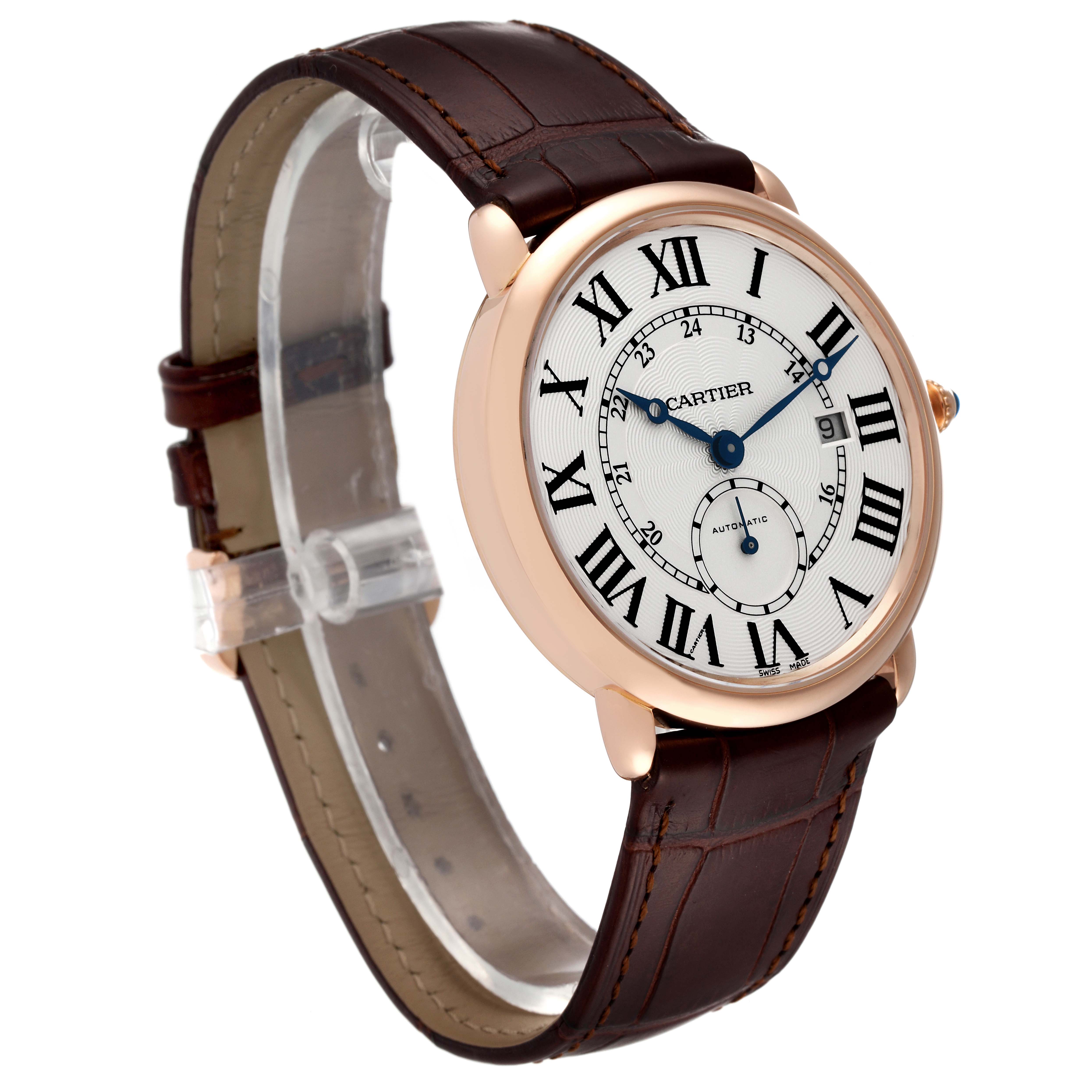 The image shows a side angle of a Cartier Ronde W6801005 Men
s Rose Gold Silver Dial W6801005 Men
s Rose Gold Silver Dial watch, highlighting its brown leather strap and round dial with Roman numerals.
