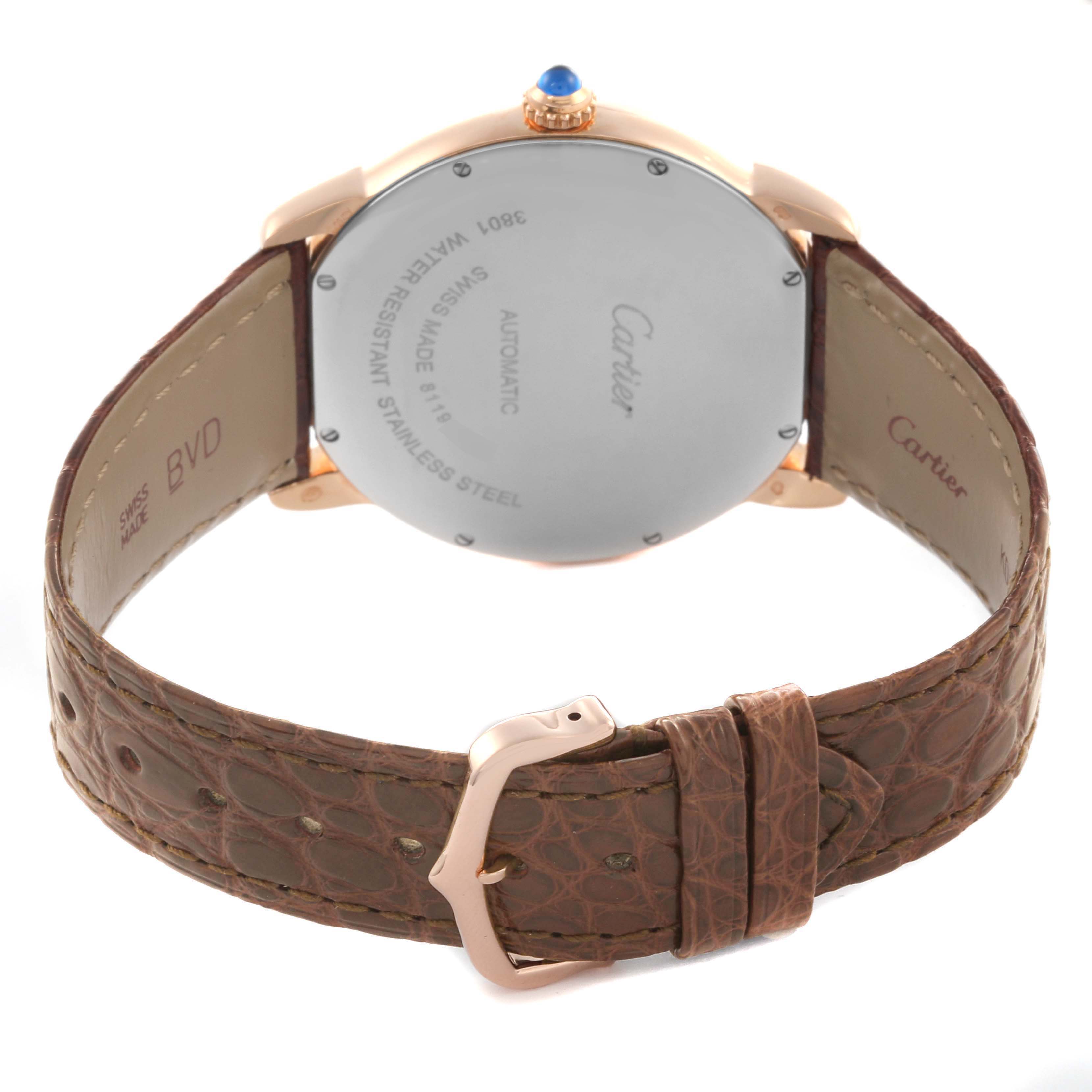 The Cartier Ronde W6701009 Men
s Rose Gold Silver Dial W6701009 Men
s Rose Gold Silver Dial watch is shown from the back, highlighting the case back and brown leather strap with buckle.