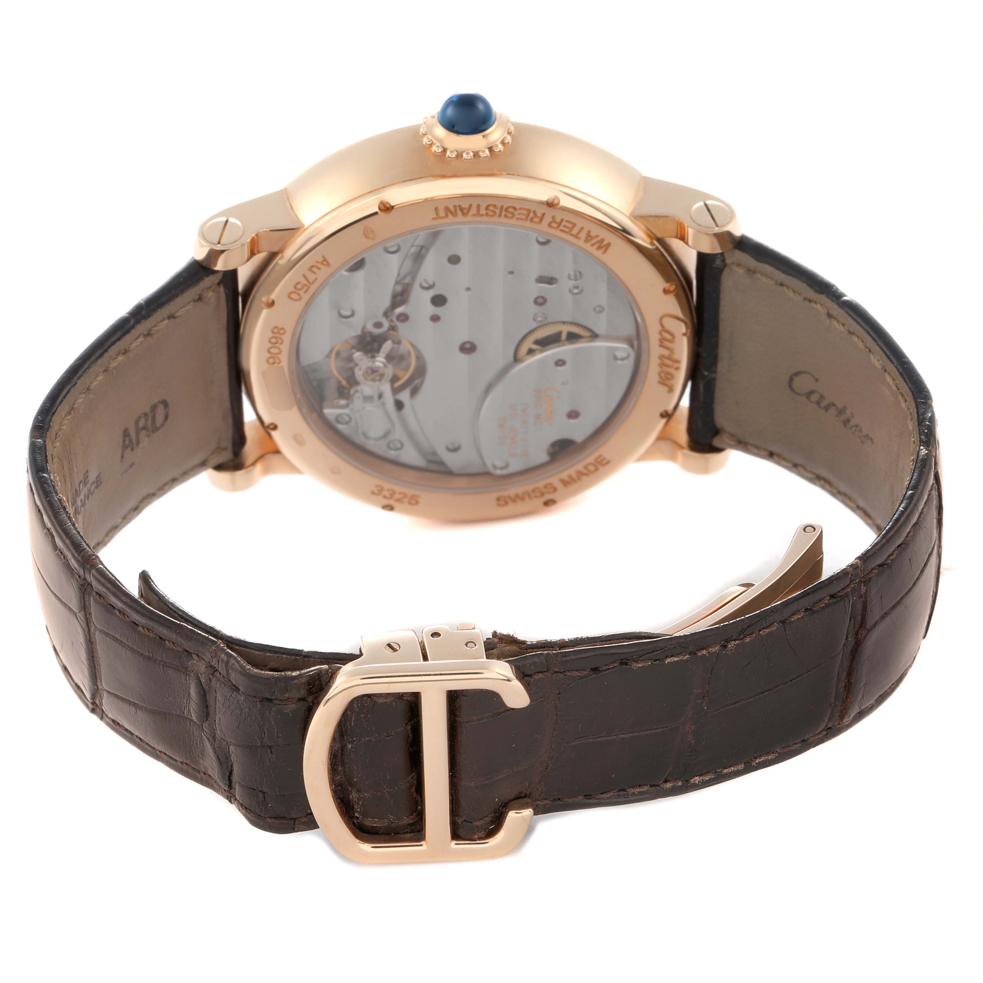 The image shows the back of a Cartier Rotonde W1556203 Men
s Rose Gold Silver Dial watch, displaying the movement and leather strap with a clasp.