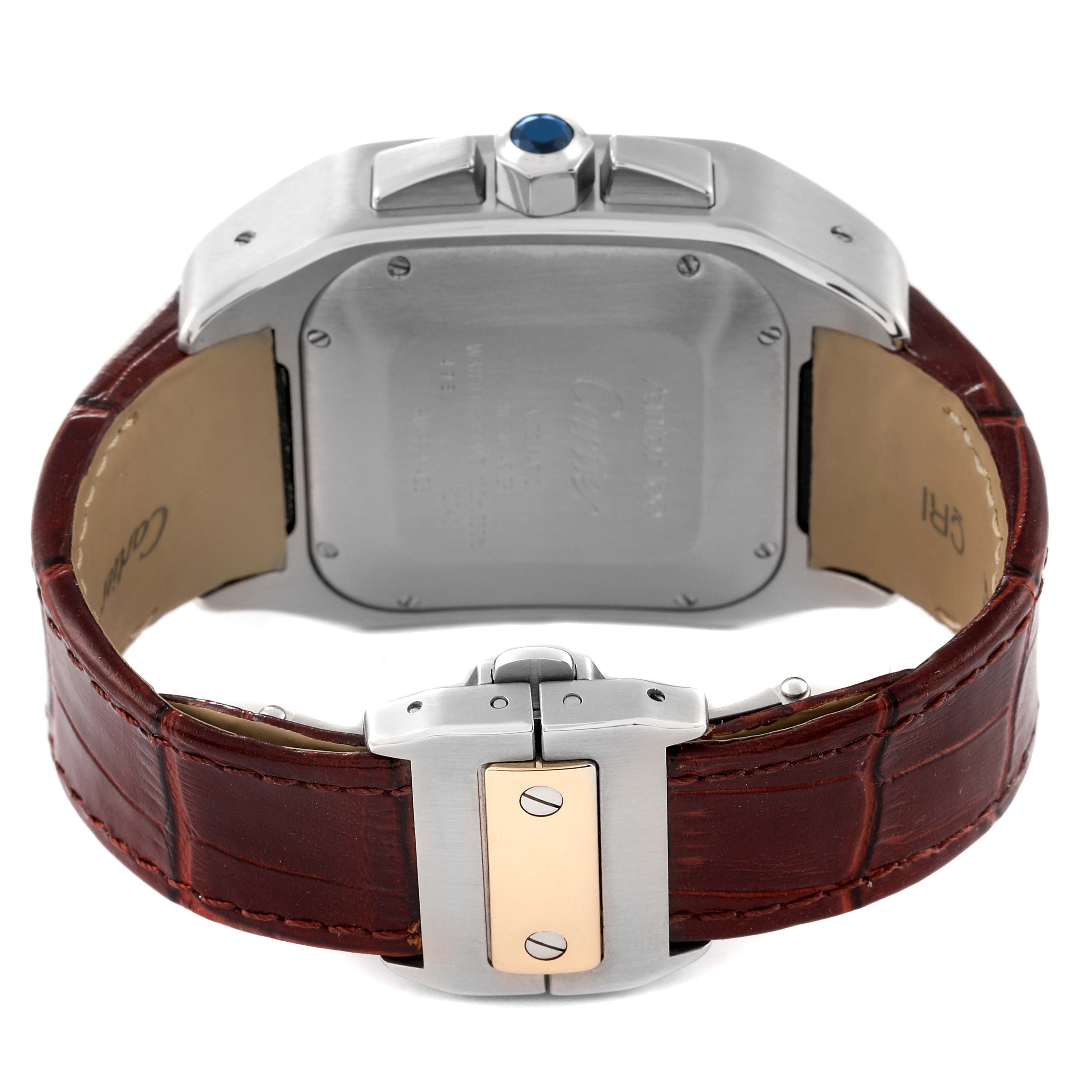 This image shows the back view of the Cartier Santos W20091X7 Men's Steel and Gold (two tone) Silver Dial W20091X7 Men's Steel and Gold (two tone) Silver Dial watch, highlighting the case back, brown leather strap, and clasp.