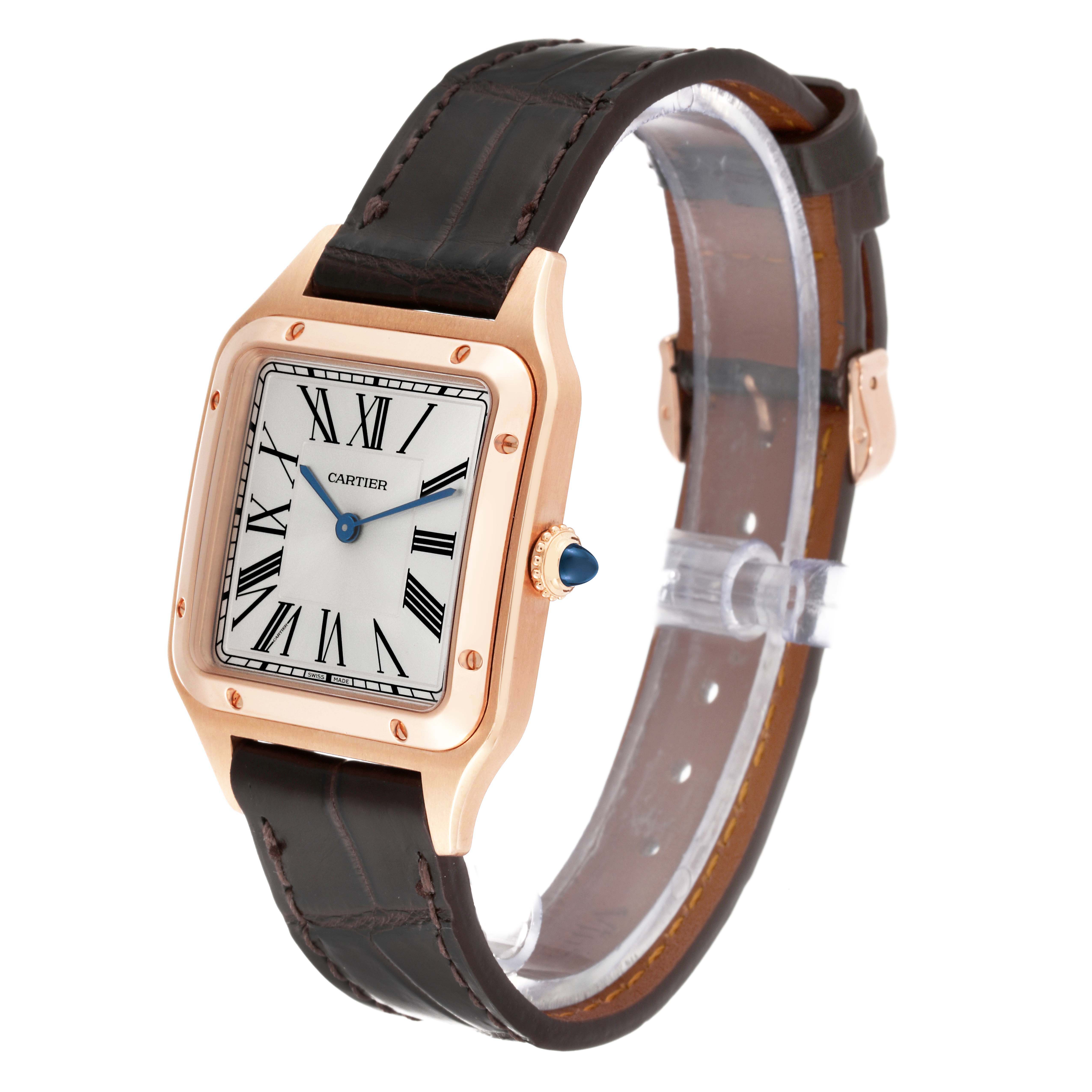 The Cartier Santos Dumont WGSA0021 Men's Rose Gold Silver Dial watch is shown at a three-quarter angle, highlighting the case, dial, crown, and leather strap.