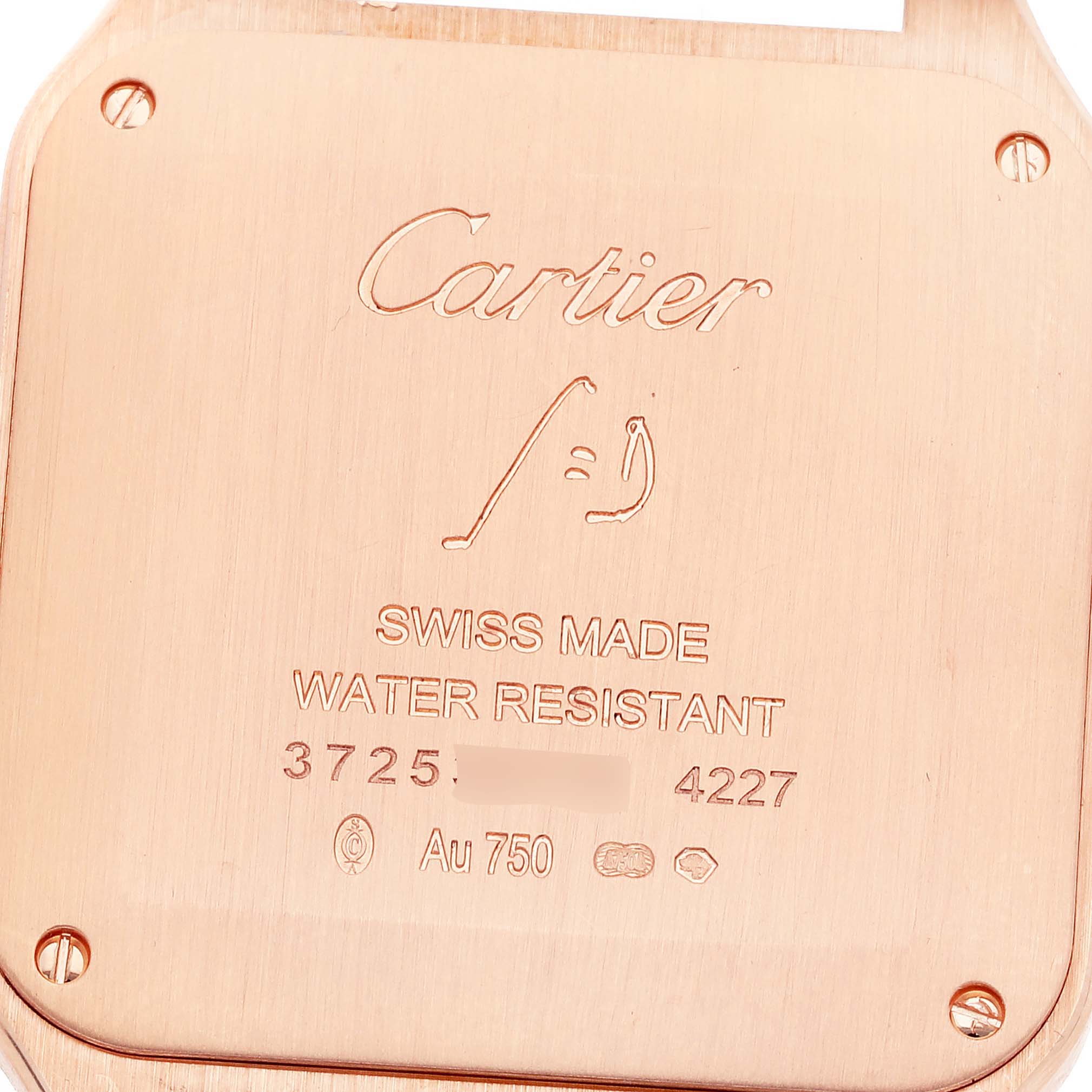 This image shows the back case of a Santos Dumont watch by Cartier, displaying the brand name and specifications.