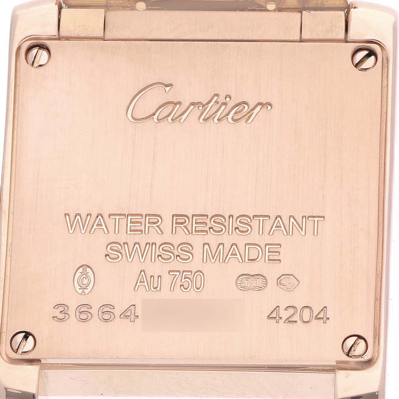 The image shows the back case of a Cartier Tank Française watch, featuring engraved branding and specifications.