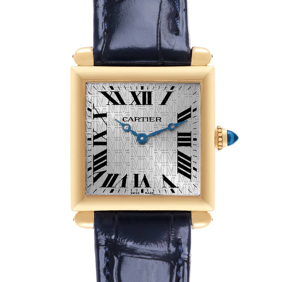 The Cartier Tank Obus watch is shown from the front, highlighting the dial, hands, and crown with a sapphire cabochon.