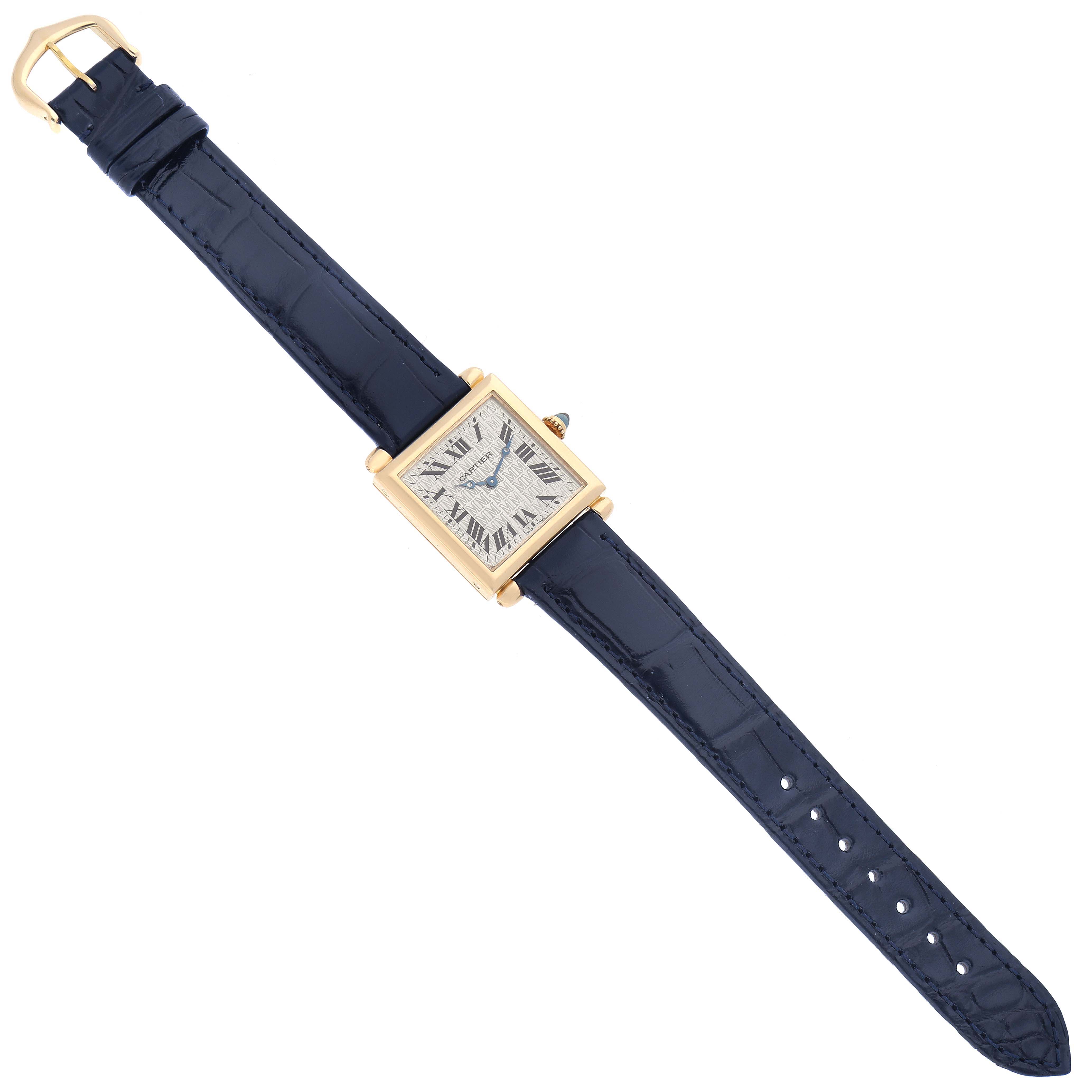 The Cartier Tank Obus W1532756 Women's Yellow Gold Silver Dial W1532756 Women's Yellow Gold Silver Dial watch is shown from a top-down angle, displaying the face, case, strap, and buckle.