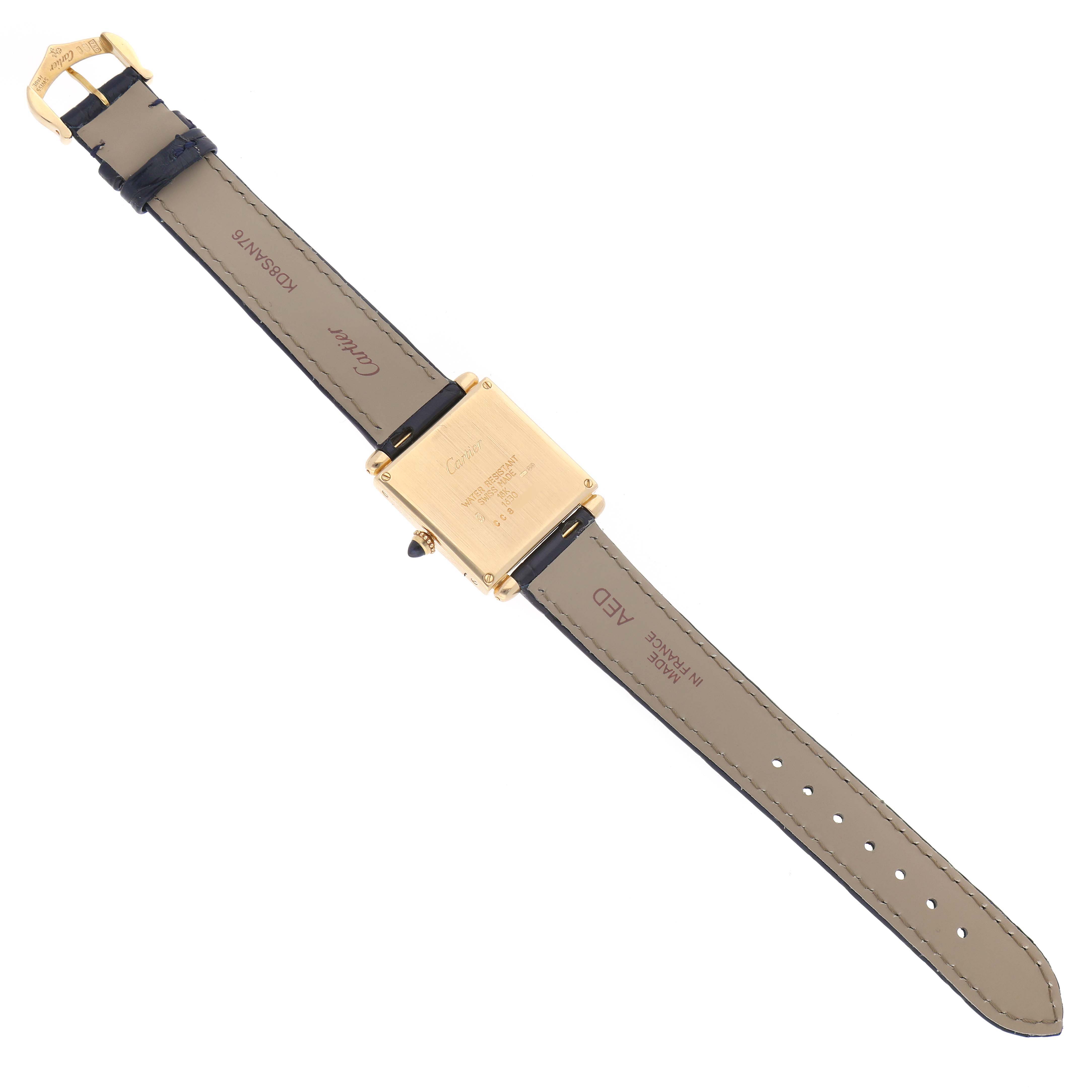 The Cartier Tank Obus W1532756 Women's Yellow Gold Silver Dial W1532756 Women's Yellow Gold Silver Dial watch is shown from the back, highlighting the gold case, leather straps, and buckle.