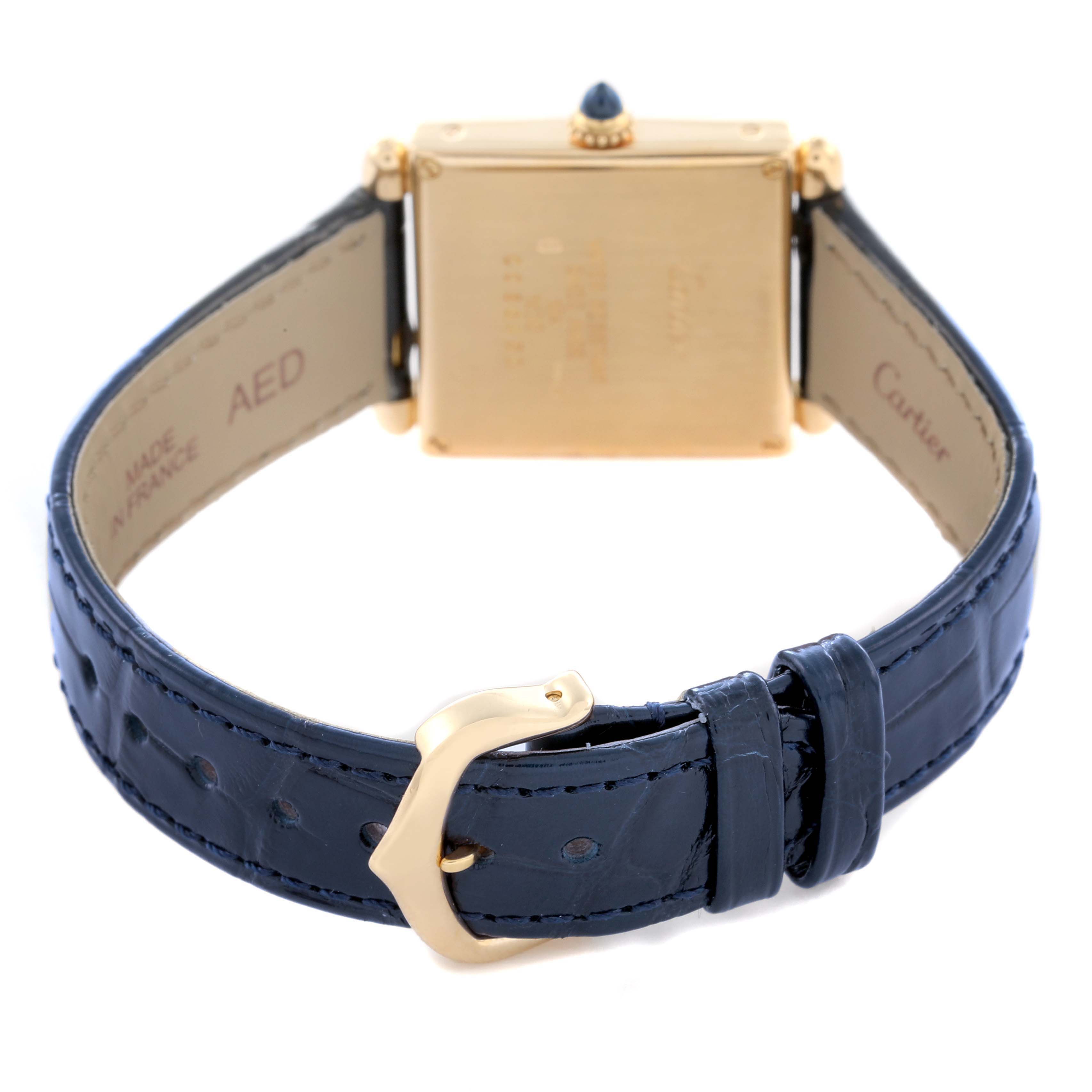 The image shows the back view of the Cartier Tank Obus W1532756 Women's Yellow Gold Silver Dial W1532756 Women's Yellow Gold Silver Dial watch, including the case back, crown, and blue leather strap with a gold buckle.