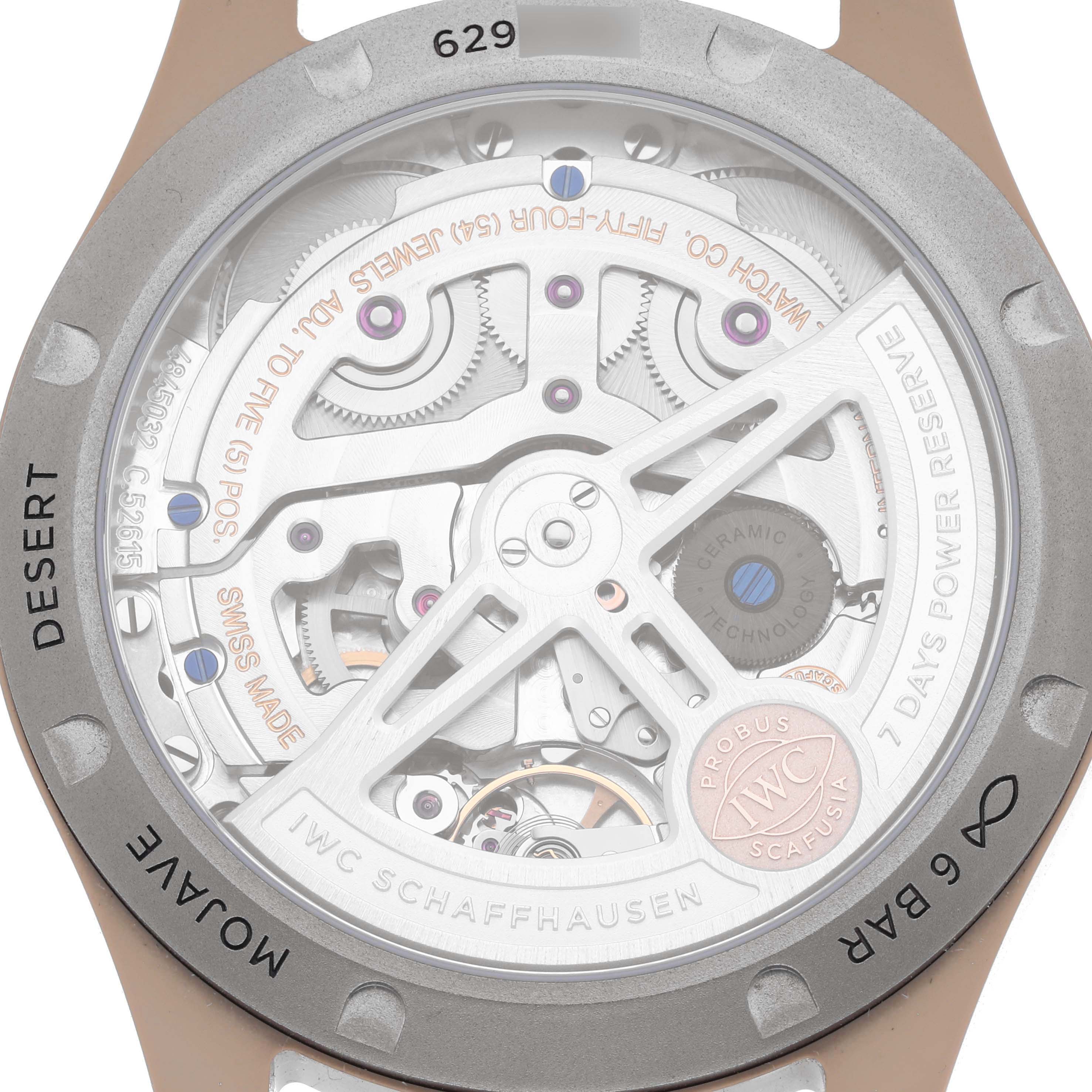 The image shows the back of the IWC Pilot IW503004 Men's Ceramic Grey Dial IW503004 Men's Ceramic Grey Dial watch, highlighting its open case back and movement details.