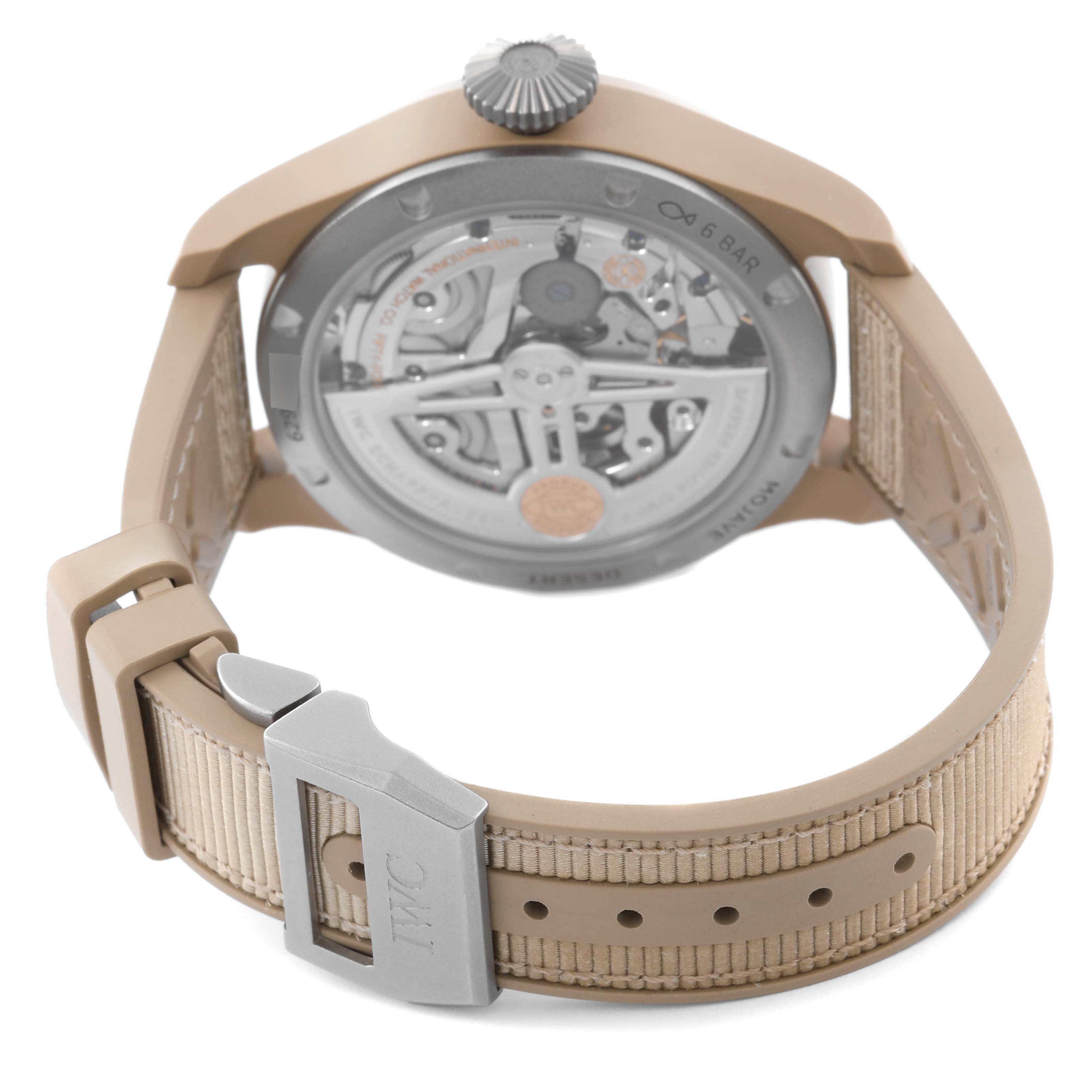 The IWC Pilot IW503004 Men's Ceramic Grey Dial IW503004 Men's Ceramic Grey Dial watch is shown from the back, highlighting its movement and strap with clasp.