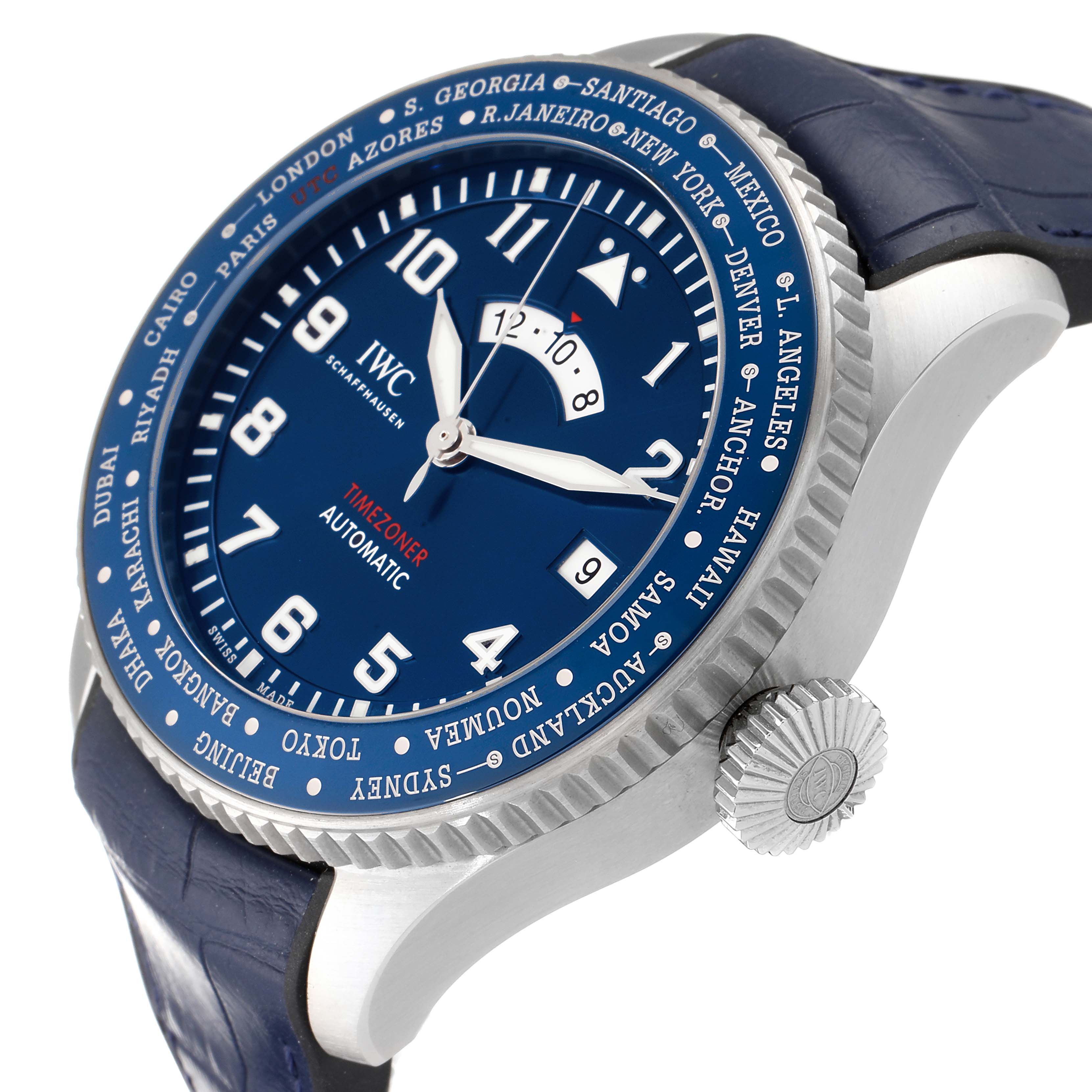 The image shows a close-up angled view of the dial and case of an IWC Pilot IW395503 Men's Stainless Steel Blue Dial IW395503 Men's Stainless Steel Blue Dial Timezoner watch, highlighting the bezel, crown, and strap.