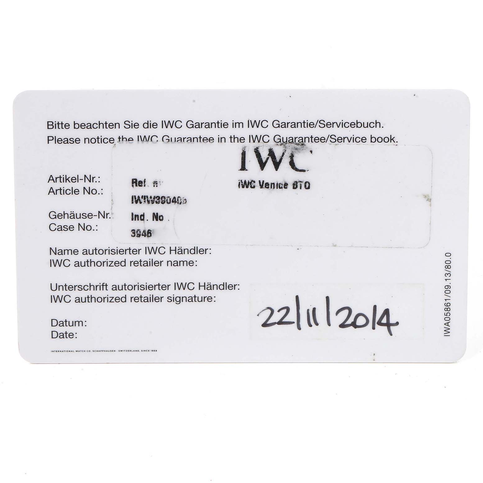 This image shows a warranty card for an IWC Portuguese IW390406 Men's Stainless Steel Blue Dial IW390406 Men's Stainless Steel Blue Dial model watch, featuring details like the article and case numbers.