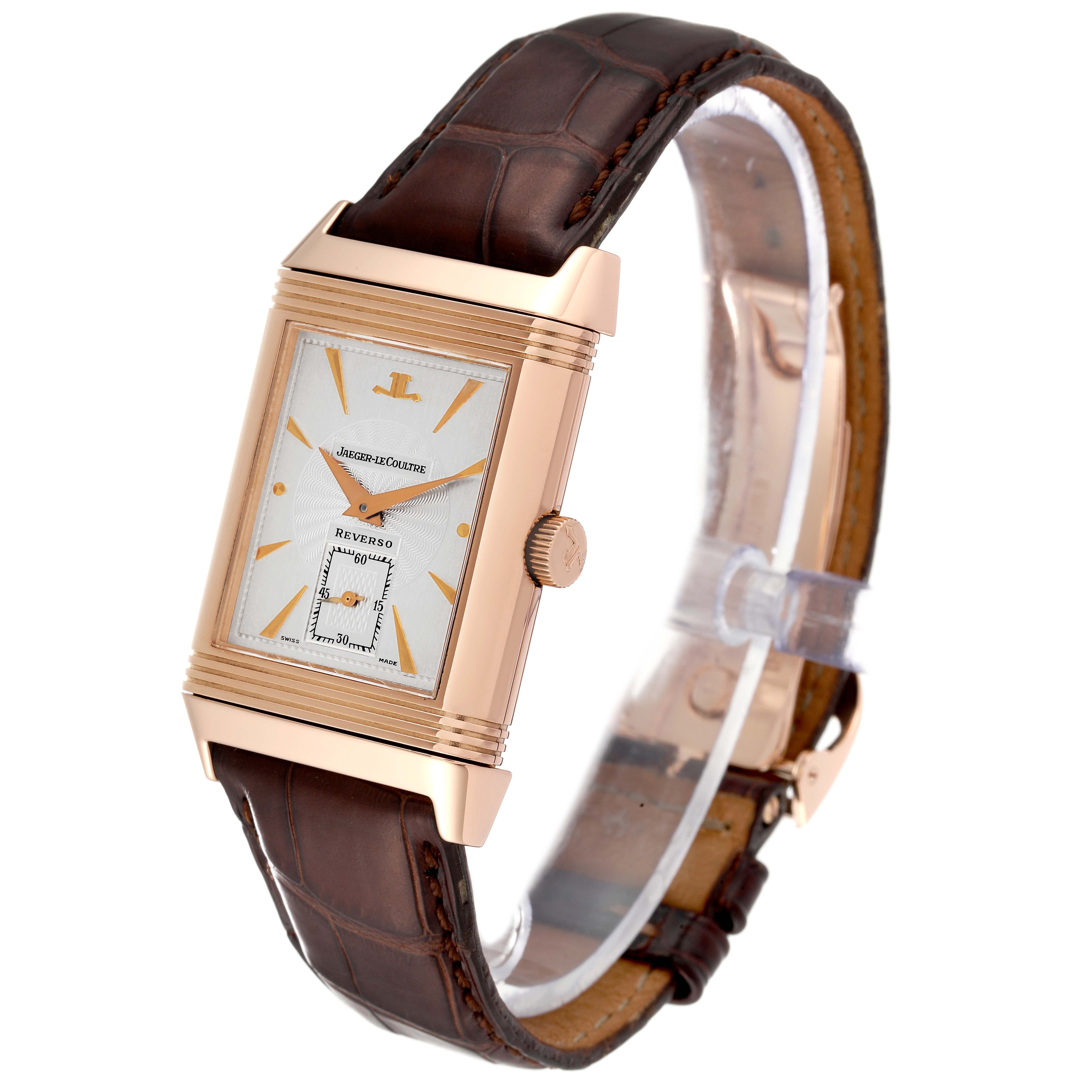 This image shows a Jaeger LeCoultre Reverso 270.2.62 Men
s Rose Gold Silver Dial 270.2.62 Men
s Rose Gold Silver Dial watch at a slight angle, highlighting its face, crown, and leather strap.