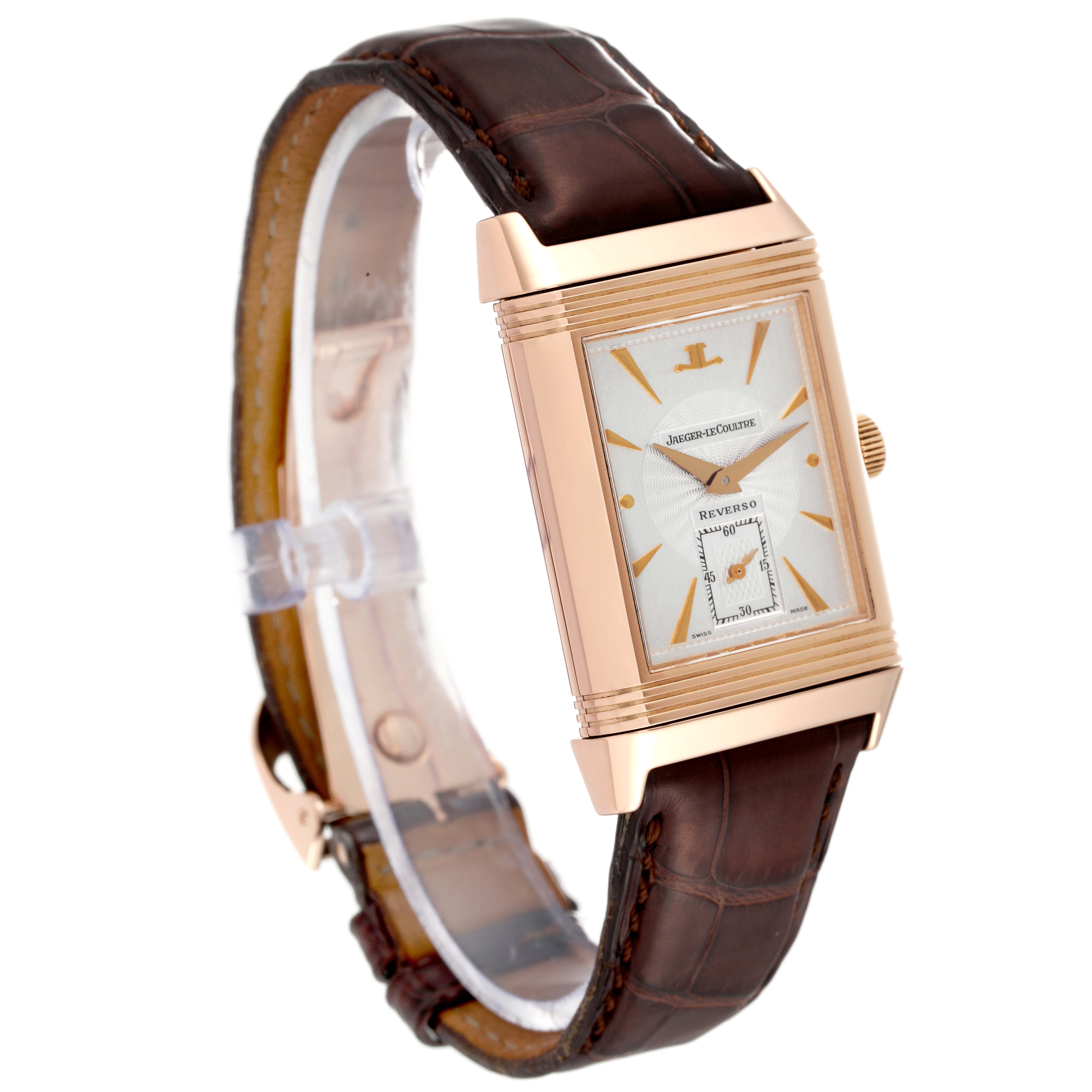 The image shows a front right angle of the Jaeger LeCoultre Reverso 270.2.62 Men
s Rose Gold Silver Dial 270.2.62 Men
s Rose Gold Silver Dial watch with a brown leather strap and rose gold case.