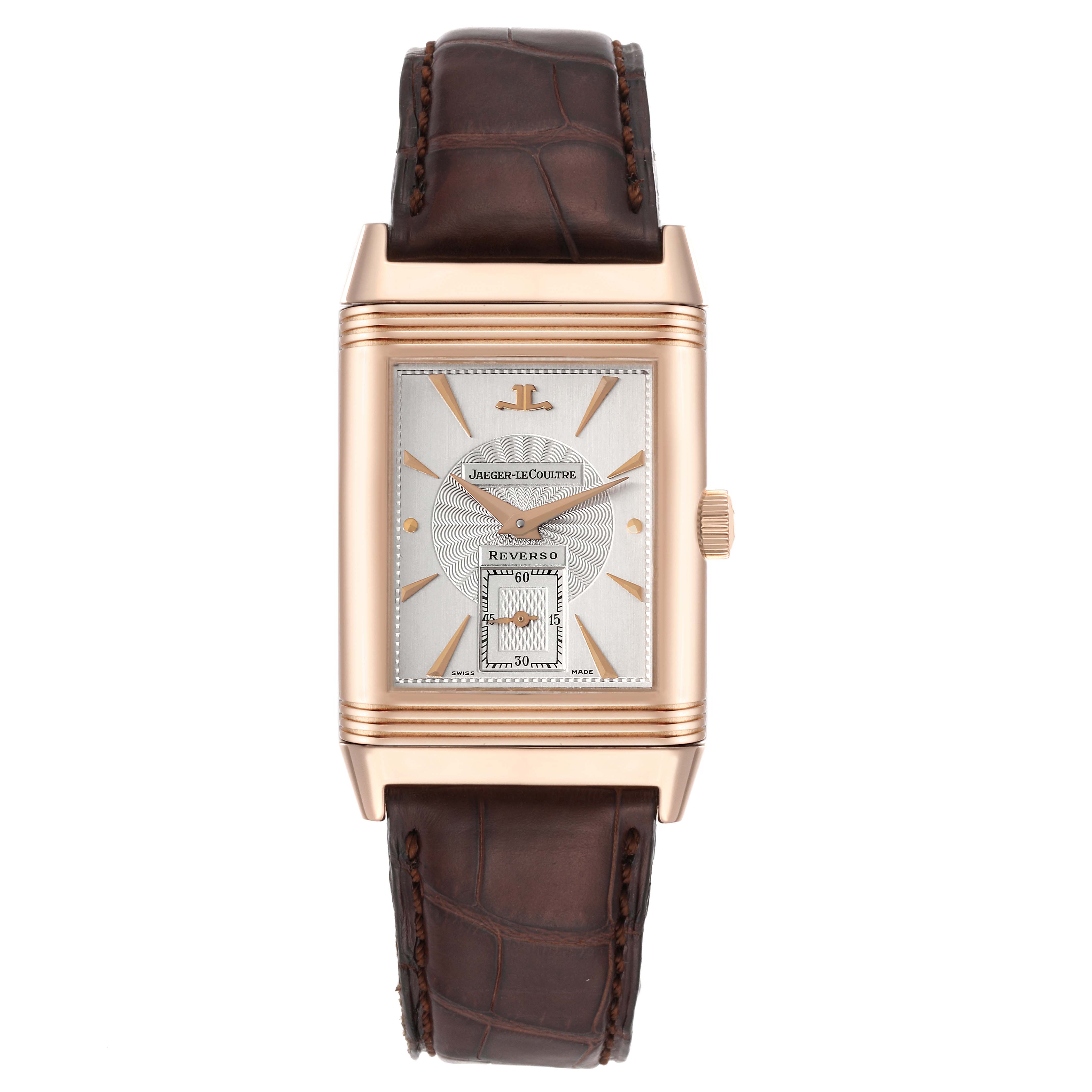 The image shows a front view of the Reverso model by Jaeger-LeCoultre, highlighting the dial, case, and brown leather strap.