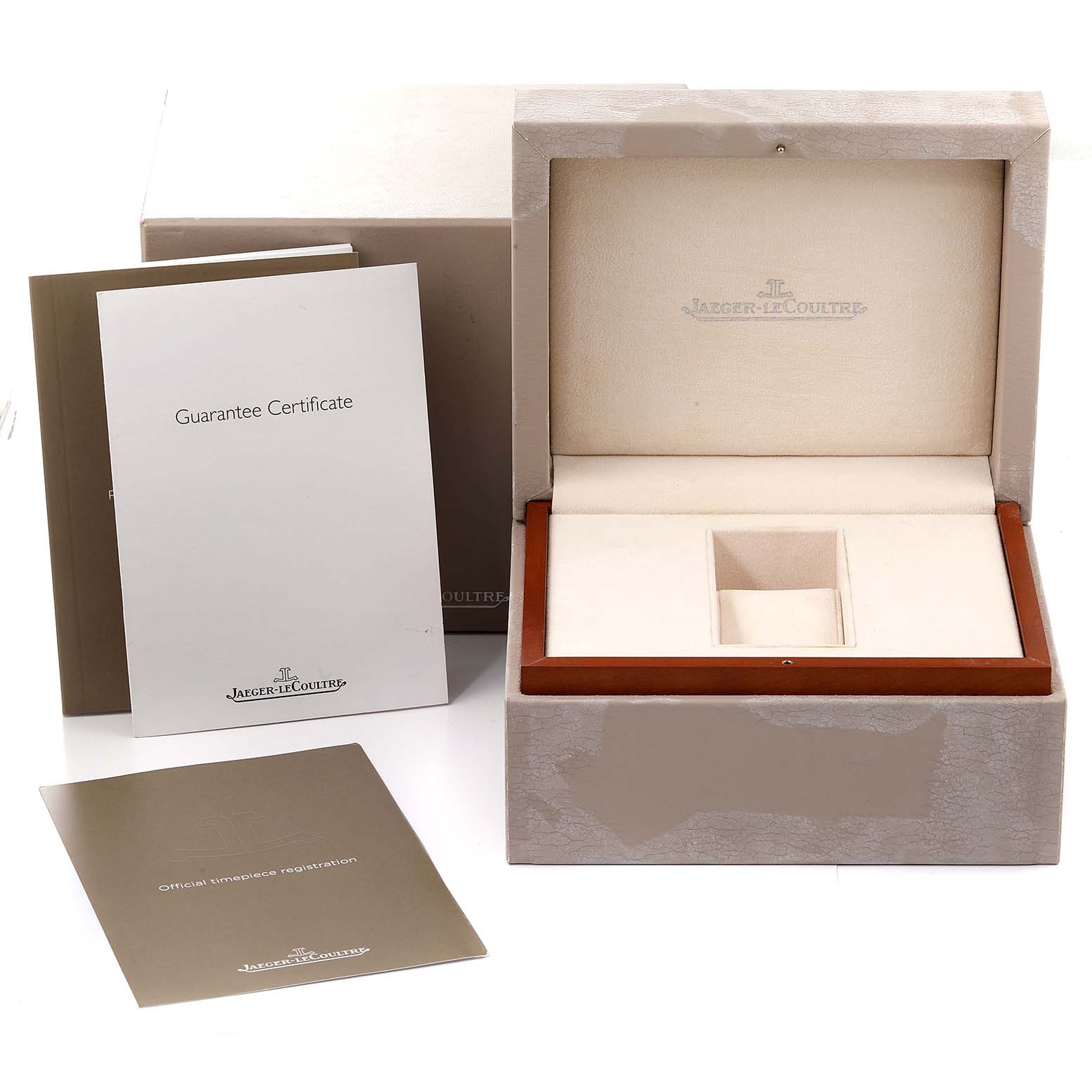 This image shows the packaging box, guarantee certificate, and official timepiece registration for a Jaeger-LeCoultre Reverso watch.