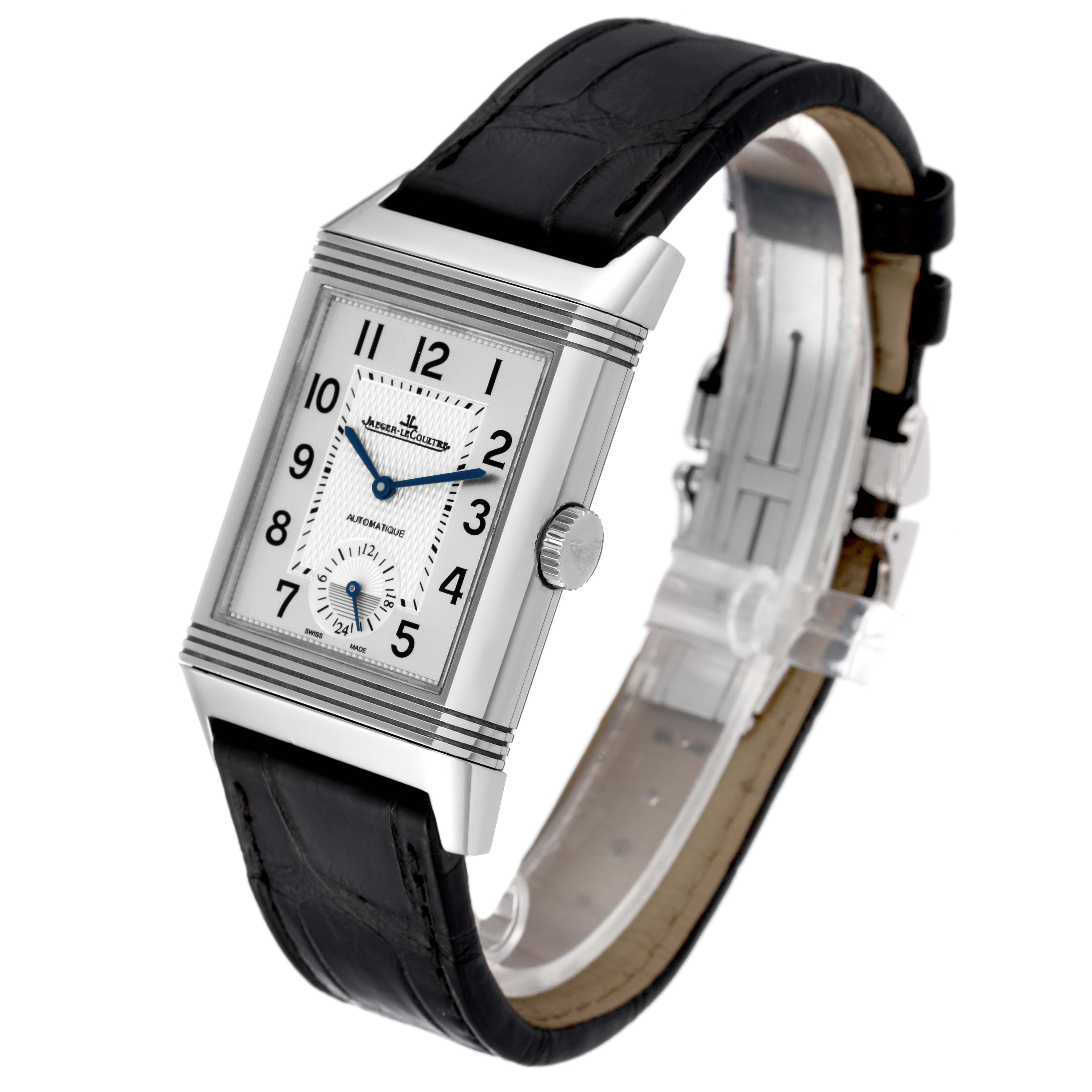 The image shows a Jaeger-LeCoultre Reverso watch at a three-quarter angle, displaying the face, crown, and strap.