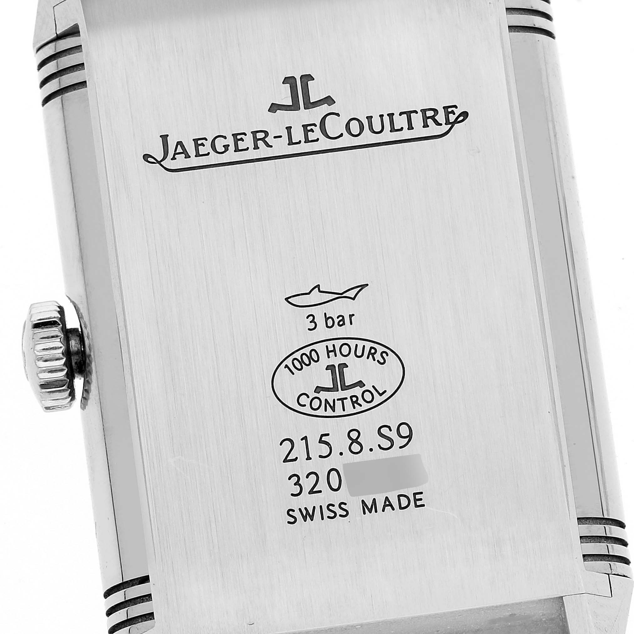 The image shows the case back of a Jaeger-LeCoultre Reverso watch, highlighting branding and specifications.