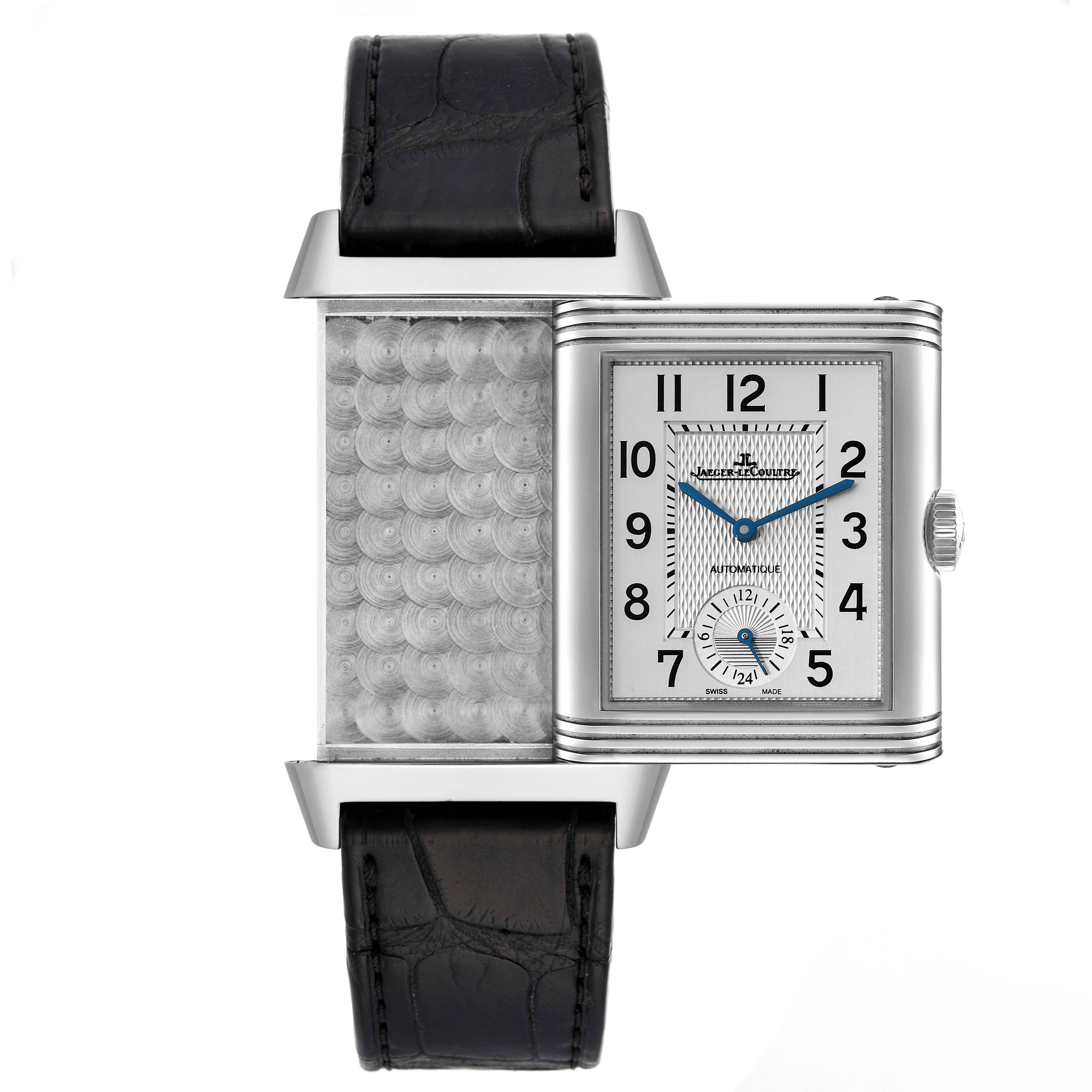 The image shows a Jaeger-LeCoultre Reverso watch with its reversible case partially rotated, exposing the back.