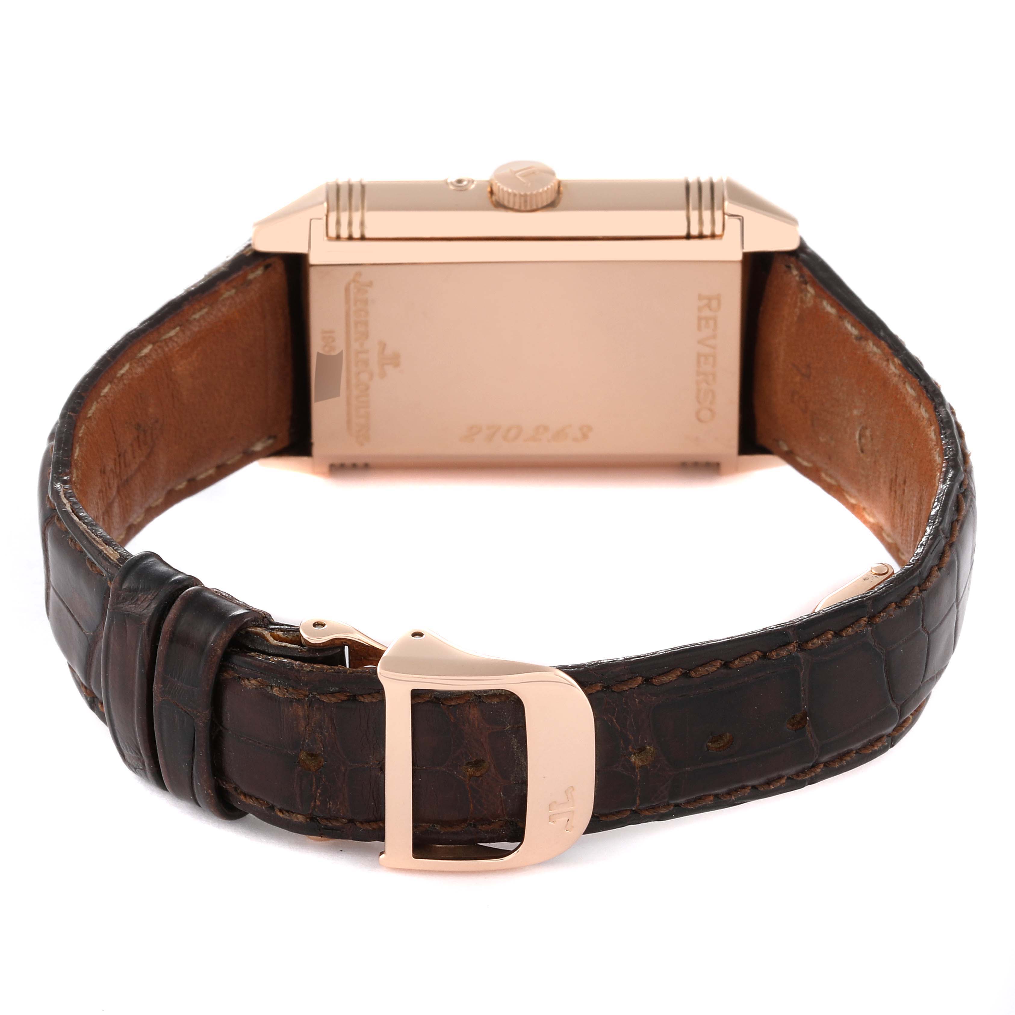 The image shows the back view of a Jaeger LeCoultre Reverso 270.2.63 Q2752420 Men
s Rose Gold Silver Dial 270.2.63 Q2752420 Men
s Rose Gold Silver Dial watch, highlighting the case back and leather strap with a gold buckle.