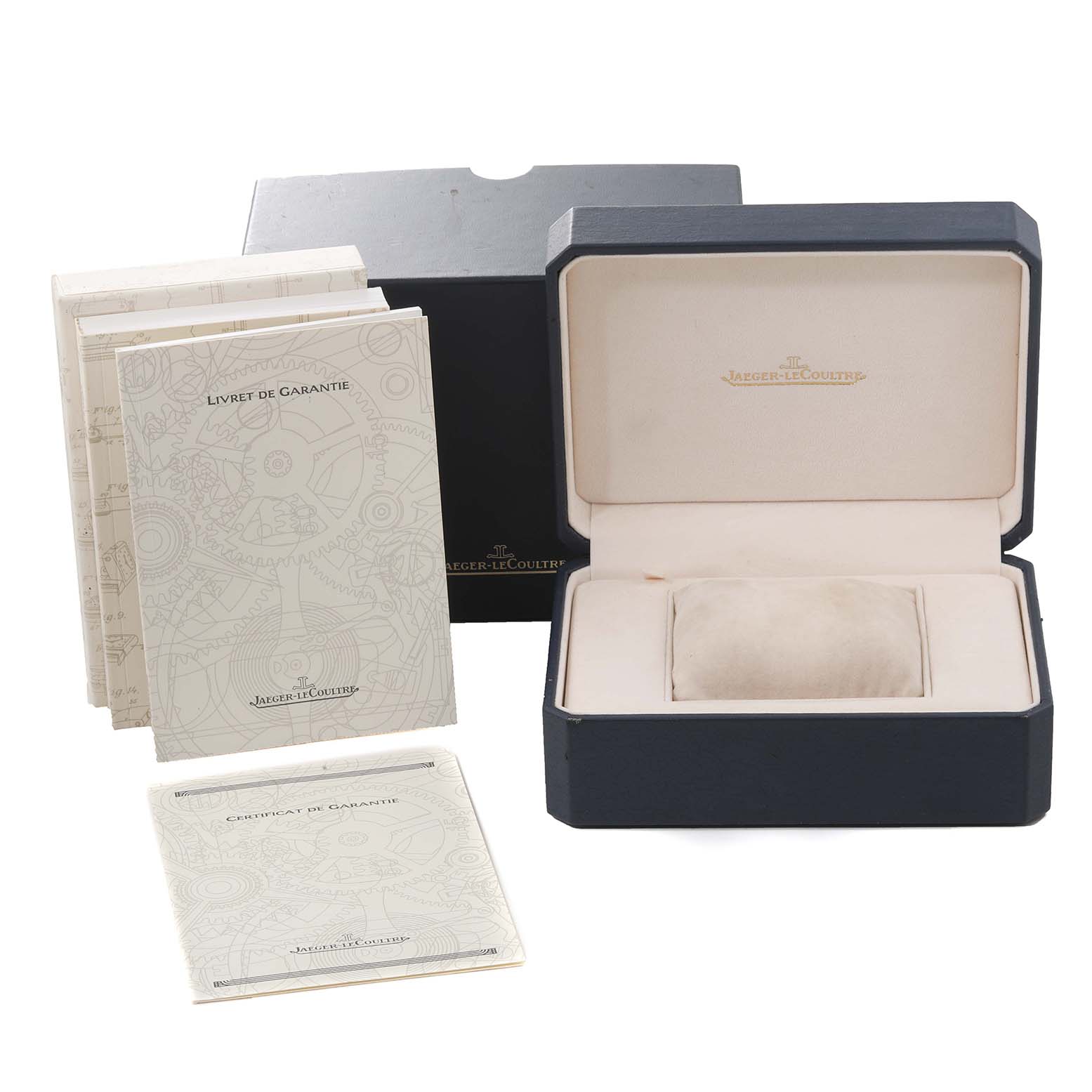 The image shows the box, guarantee booklets, and a cushion for a Jaeger-LeCoultre Reverso model watch.