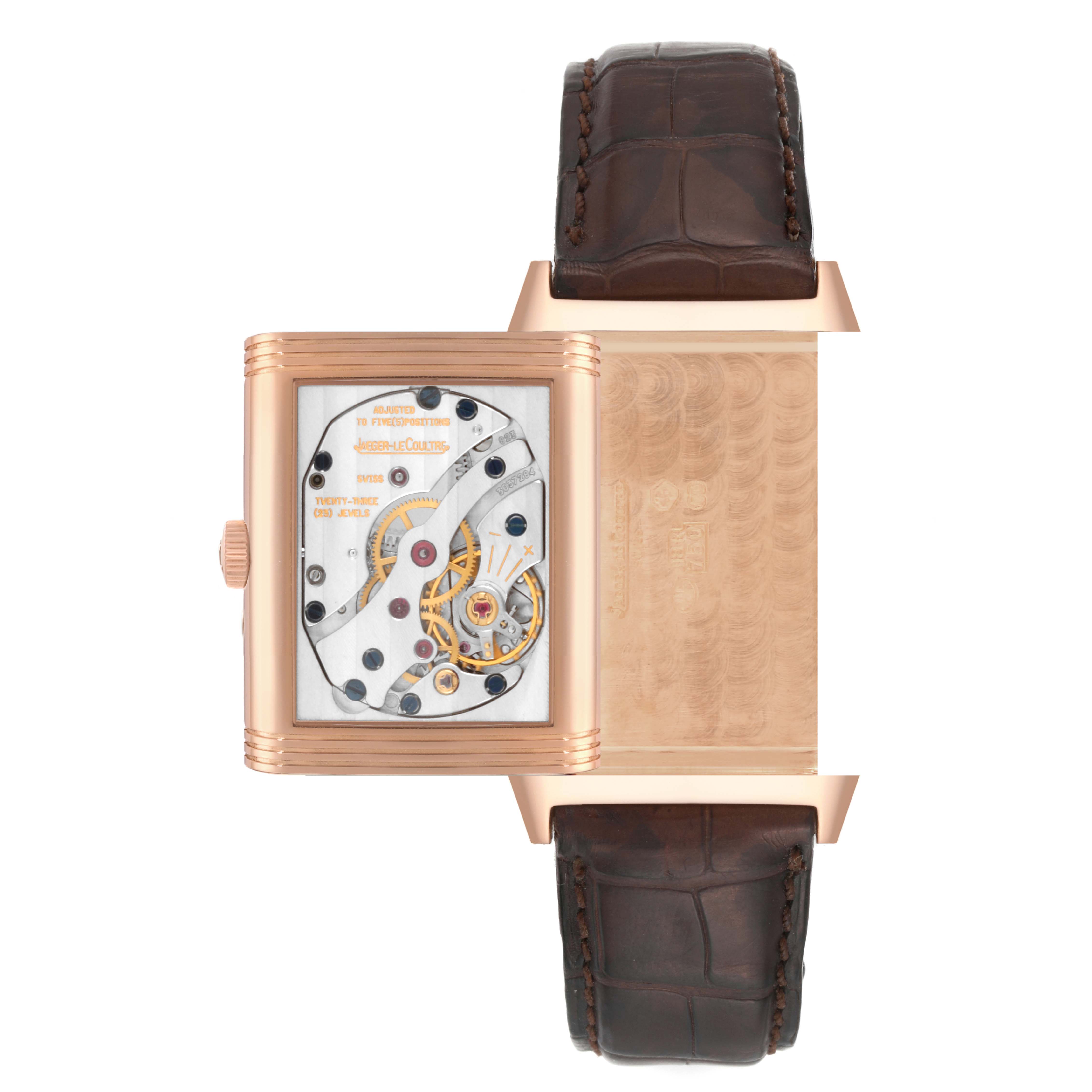 The image shows the back view of the Jaeger-LeCoultre Reverso model, displaying its exposed movement and brown leather strap.