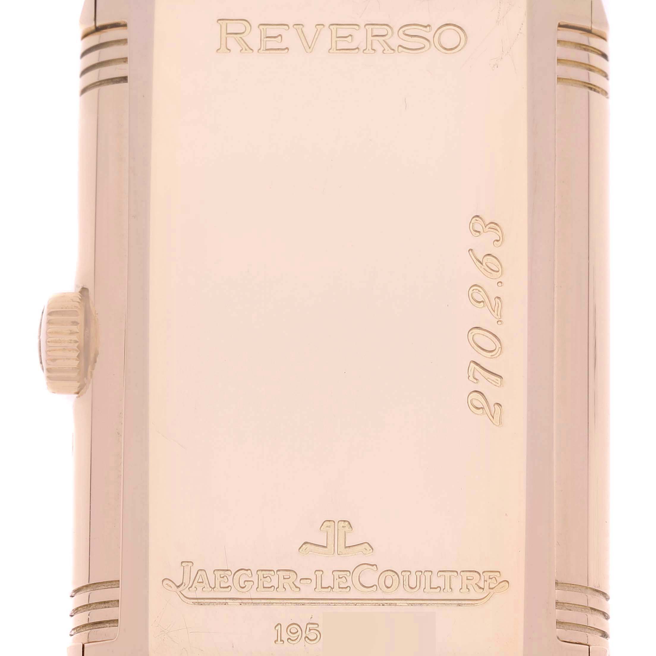 The image shows the back side of a Jaeger LeCoultre Reverso 270.2.63 Q2752420 Men
s Rose Gold Silver Dial 270.2.63 Q2752420 Men
s Rose Gold Silver Dial watch, including the crown and engraved details.