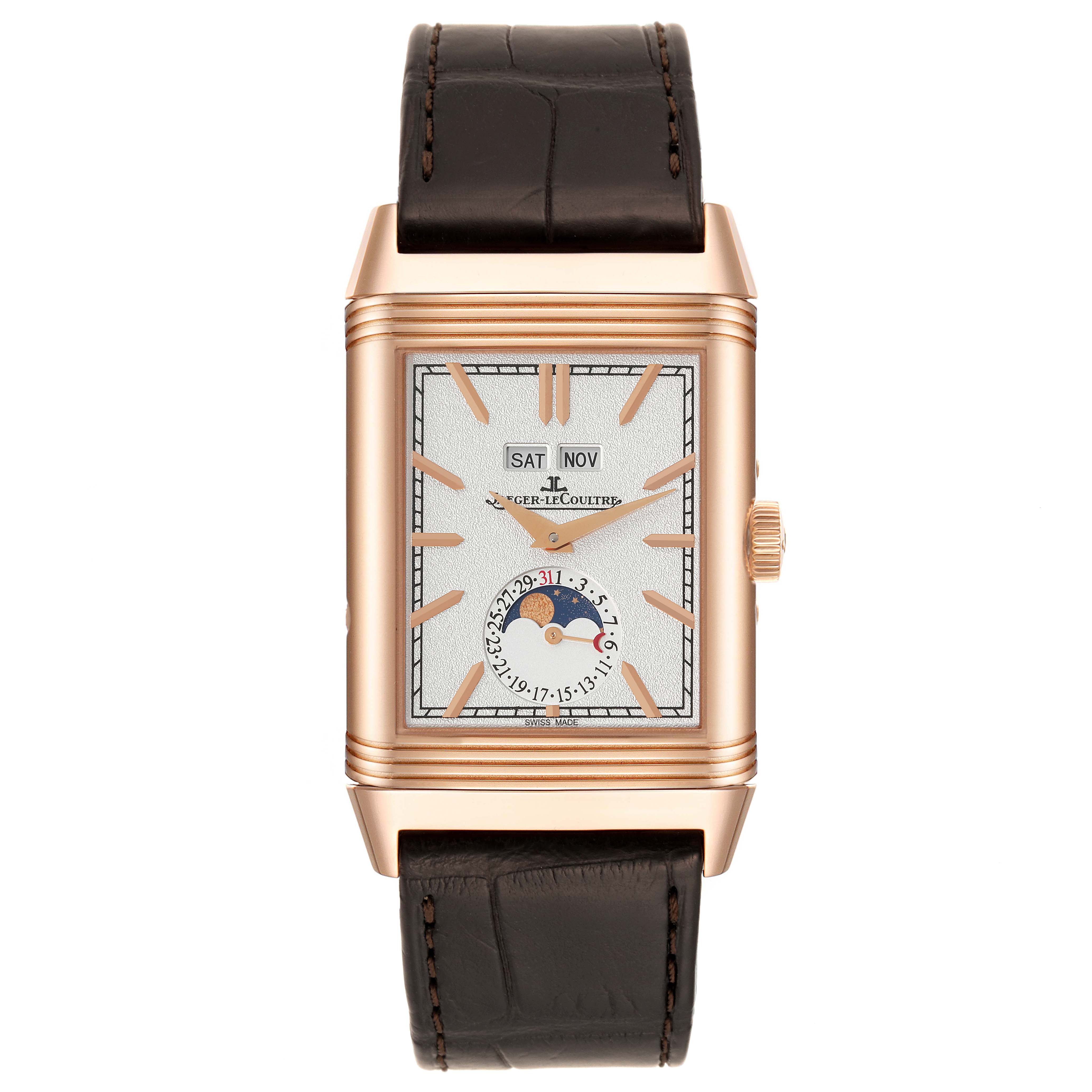A front view of a Jaeger-LeCoultre Reverso watch displaying the dial, calendar, moon phase, and brown leather strap.
