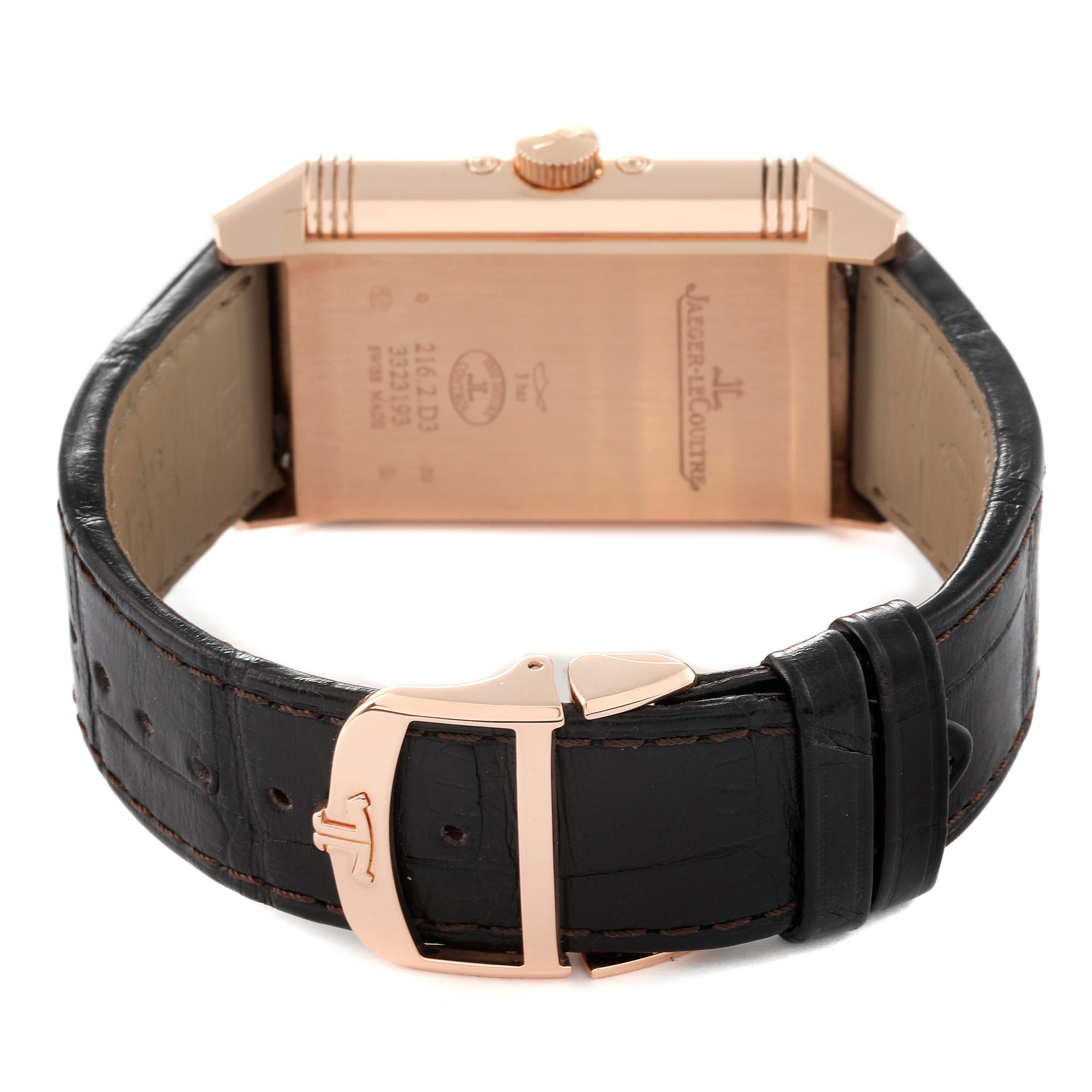 This image shows the backside of the Jaeger LeCoultre Reverso Q3912420 Men's Rose Gold Silver Dial Q3912420 Men's Rose Gold Silver Dial watch, including its case back, crown, and leather strap with a buckle.