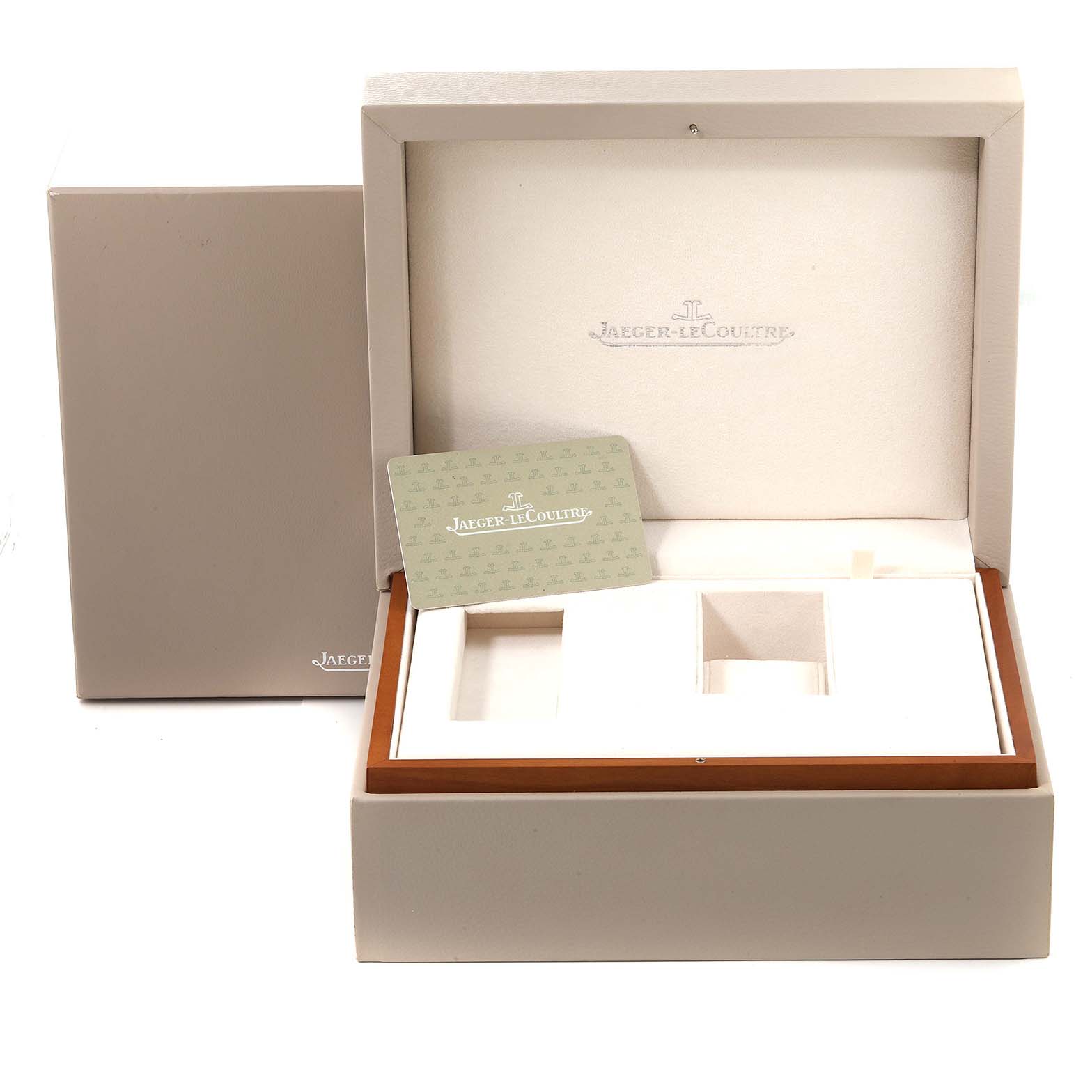 The image shows an open Jaeger-LeCoultre Reverso watch box and its outer packaging, along with a branded card.