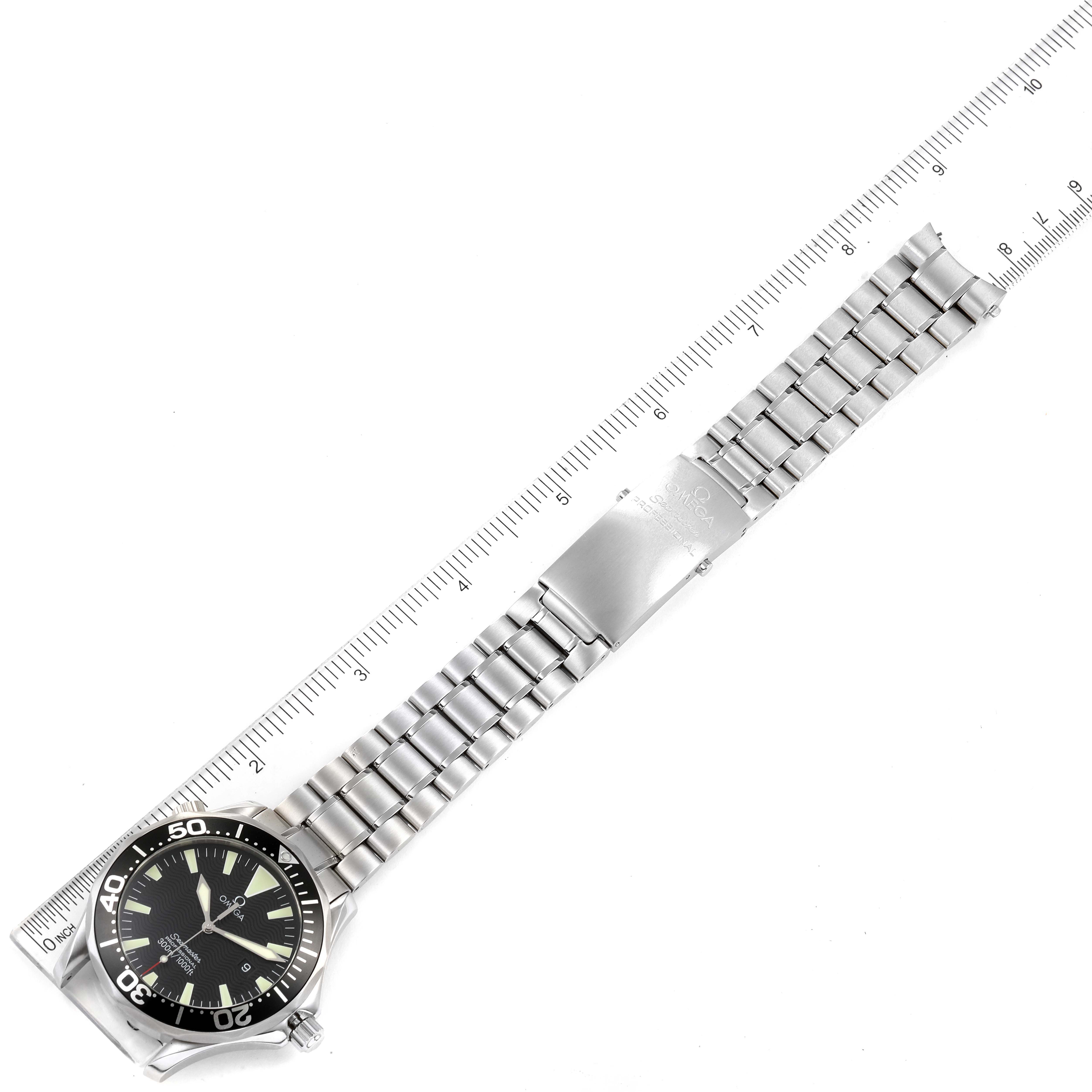 The Omega Seamaster 2264.50.00 Men's Stainless Steel Black Dial 2264.50.00 Men's Stainless Steel Black Dial watch is shown flat, with its face, bezel, and full metallic bracelet visible, placed against a ruler for scale.