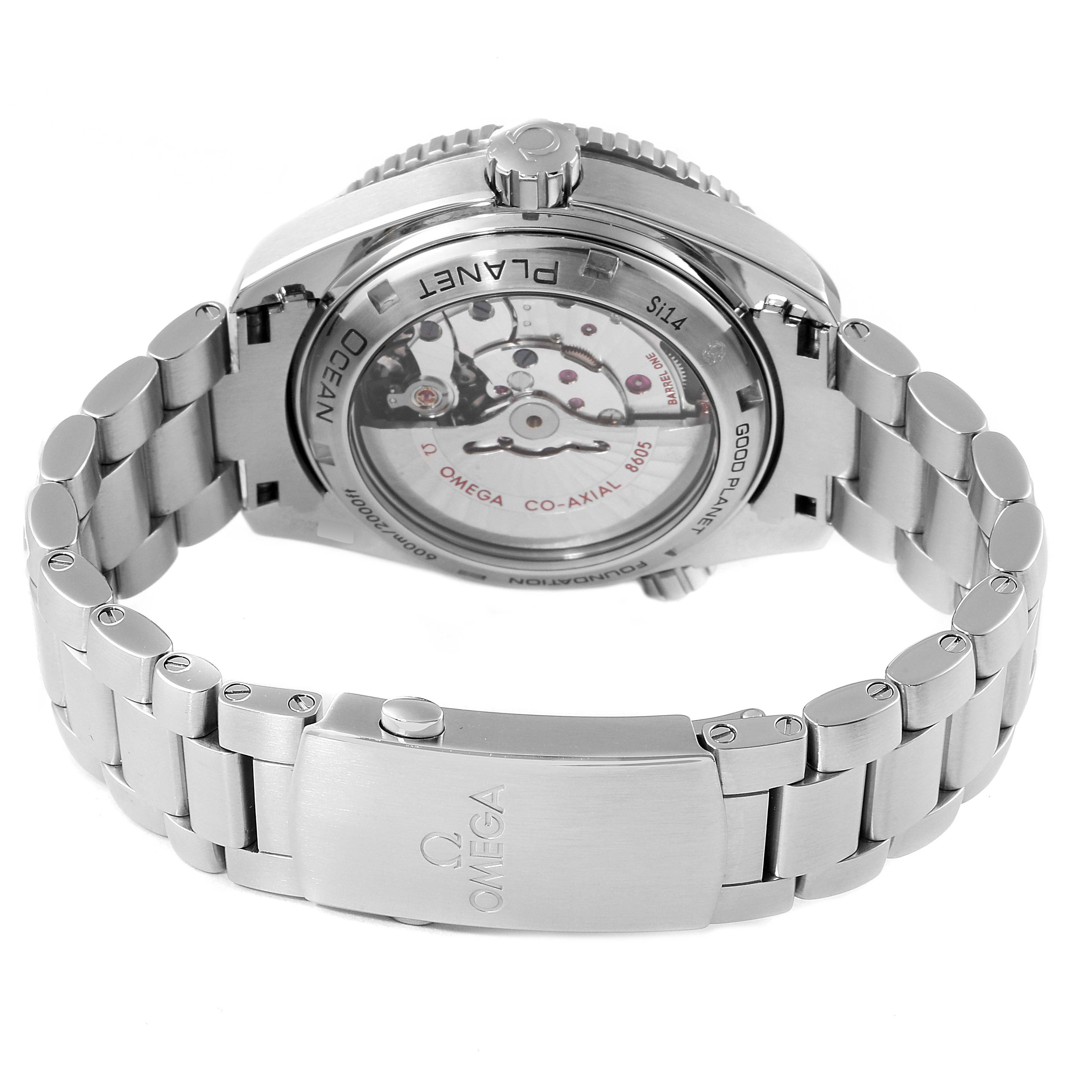 The image shows the back view of the Omega Planet Ocean 232.30.44.22.03.001 Men's Stainless Steel Blue Dial 232.30.44.22.03.001 Men's Stainless Steel Blue Dial watch, highlighting the movement and part of the bracelet.