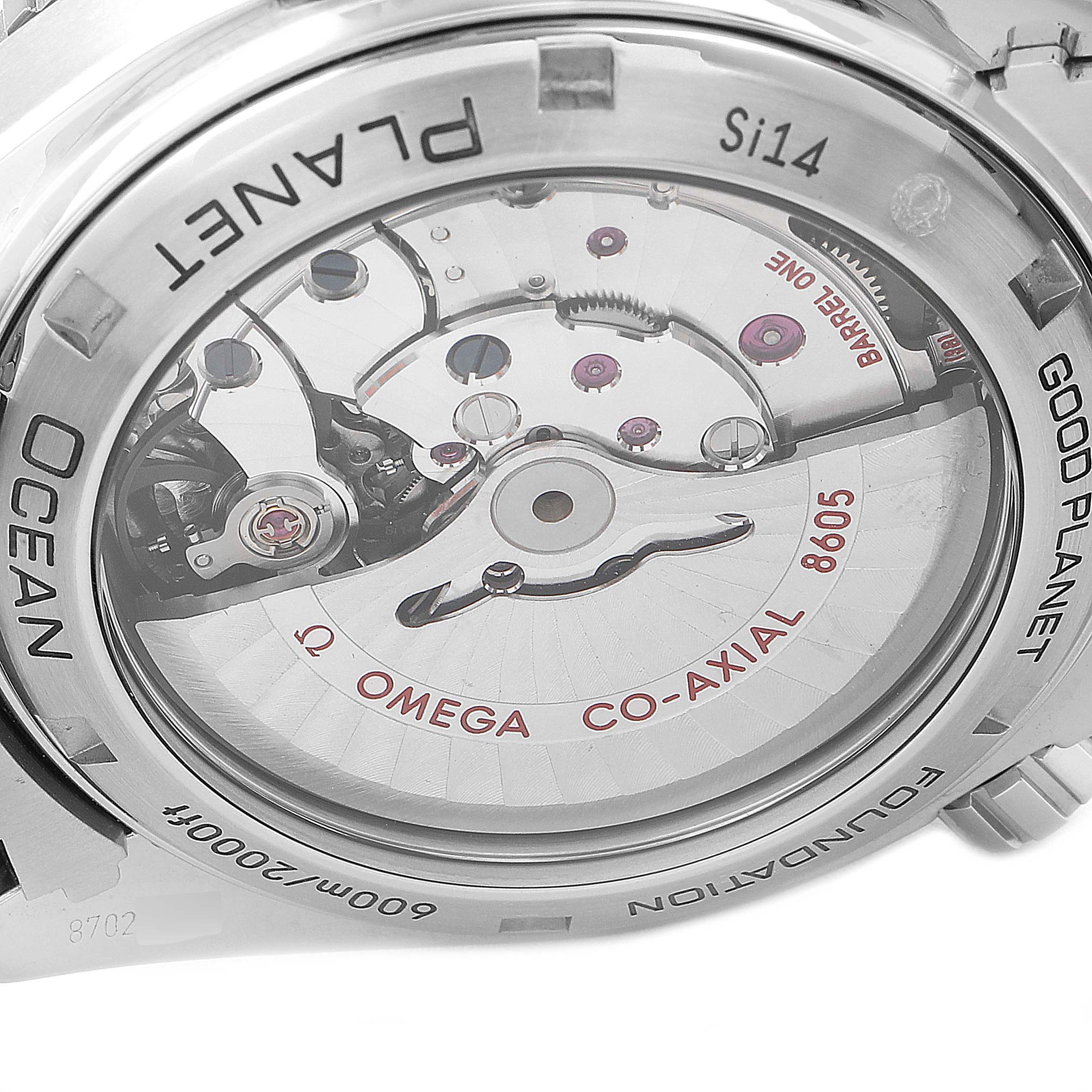 The image shows the back of the Omega Planet Ocean 232.30.44.22.03.001 Men's Stainless Steel Blue Dial 232.30.44.22.03.001 Men's Stainless Steel Blue Dial watch, revealing its internal mechanical components and branding.