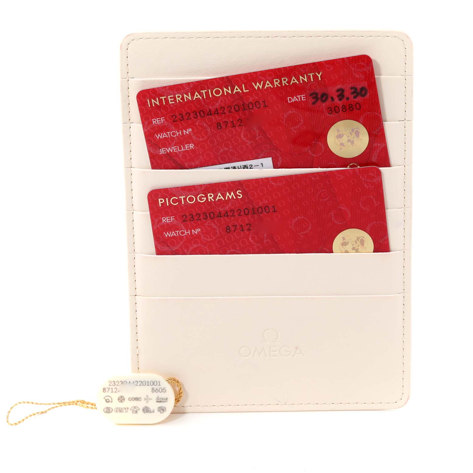 The image shows the International Warranty and Pictograms cards for an Omega Planet Ocean 232.30.44.22.01.001 Men
s Stainless Steel Black Dial 232.30.44.22.01.001 Men
s Stainless Steel Black Dial watch, along with a white identification tag.