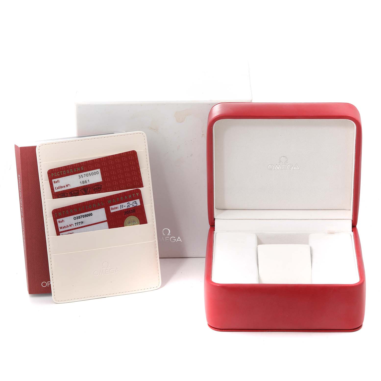 The image shows an Omega Speedmaster 3570.50.00 Men's Stainless Steel Black Dial 3570.50.00 Men's Stainless Steel Black Dial watch box, warranty cards, and a white cardholder from a slightly elevated front angle.