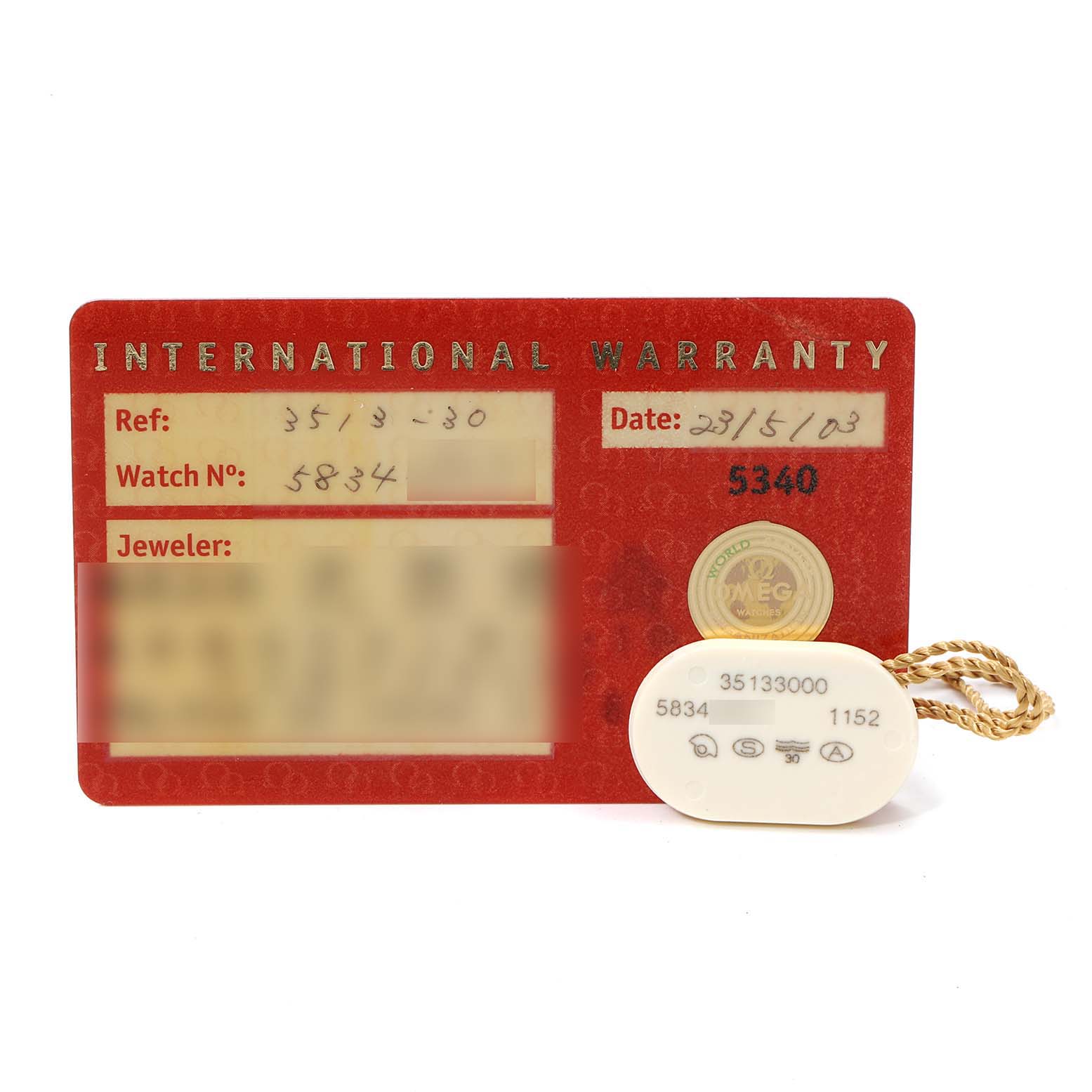 The image shows the international warranty card and a tag for the Omega Speedmaster 3513.30.00 Men
s Stainless Steel Silver Dial 3513.30.00 Men
s Stainless Steel Silver Dial watch model.