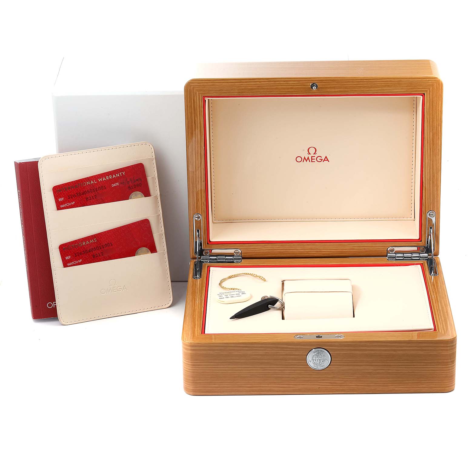 The image shows the packaging accessories for an Omega Speedmaster 326.30.40.50.11.001 Men
s Stainless Steel Red Dial 326.30.40.50.11.001 Men
s Stainless Steel Red Dial, including a wooden box, warranty cards, a manual, and a cardholder.