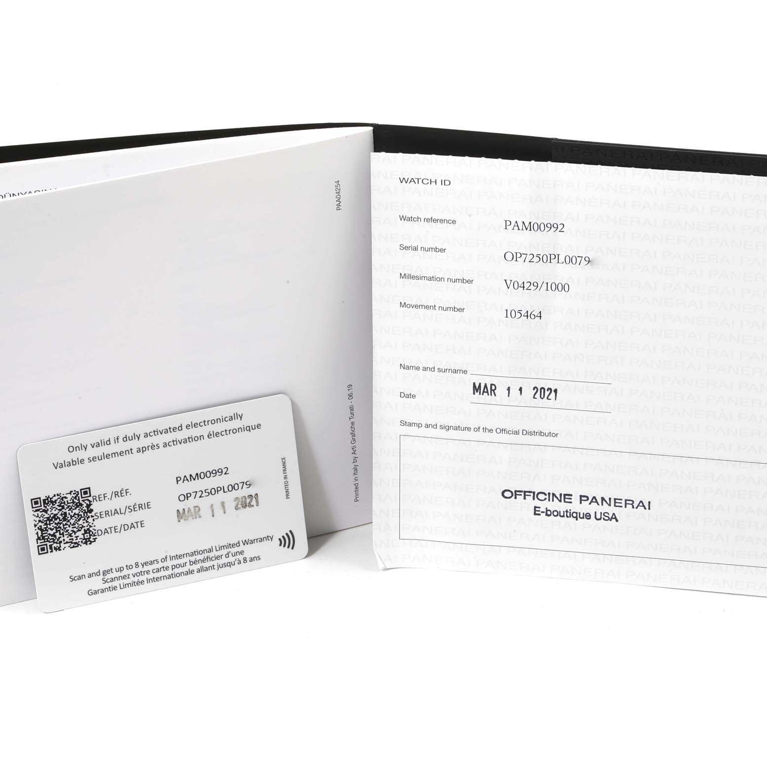 The image shows the warranty card and documentation for a Panerai Radiomir PAM00992 Men
s Stainless Steel Black Dial PAM00992 Men
s Stainless Steel Black Dial model PAM00992 watch.