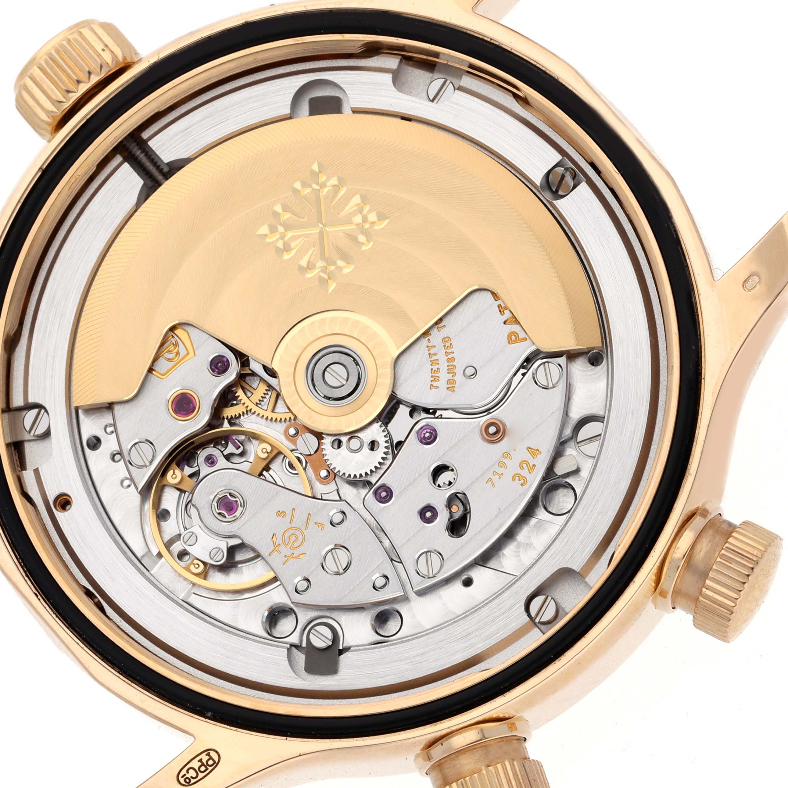 The image shows the back view of the Patek Philippe Calatrava 7234R-001 Men's Rose Gold Brown Dial 7234R-001 Men's Rose Gold Brown Dial watch, highlighting its intricate mechanical movement.