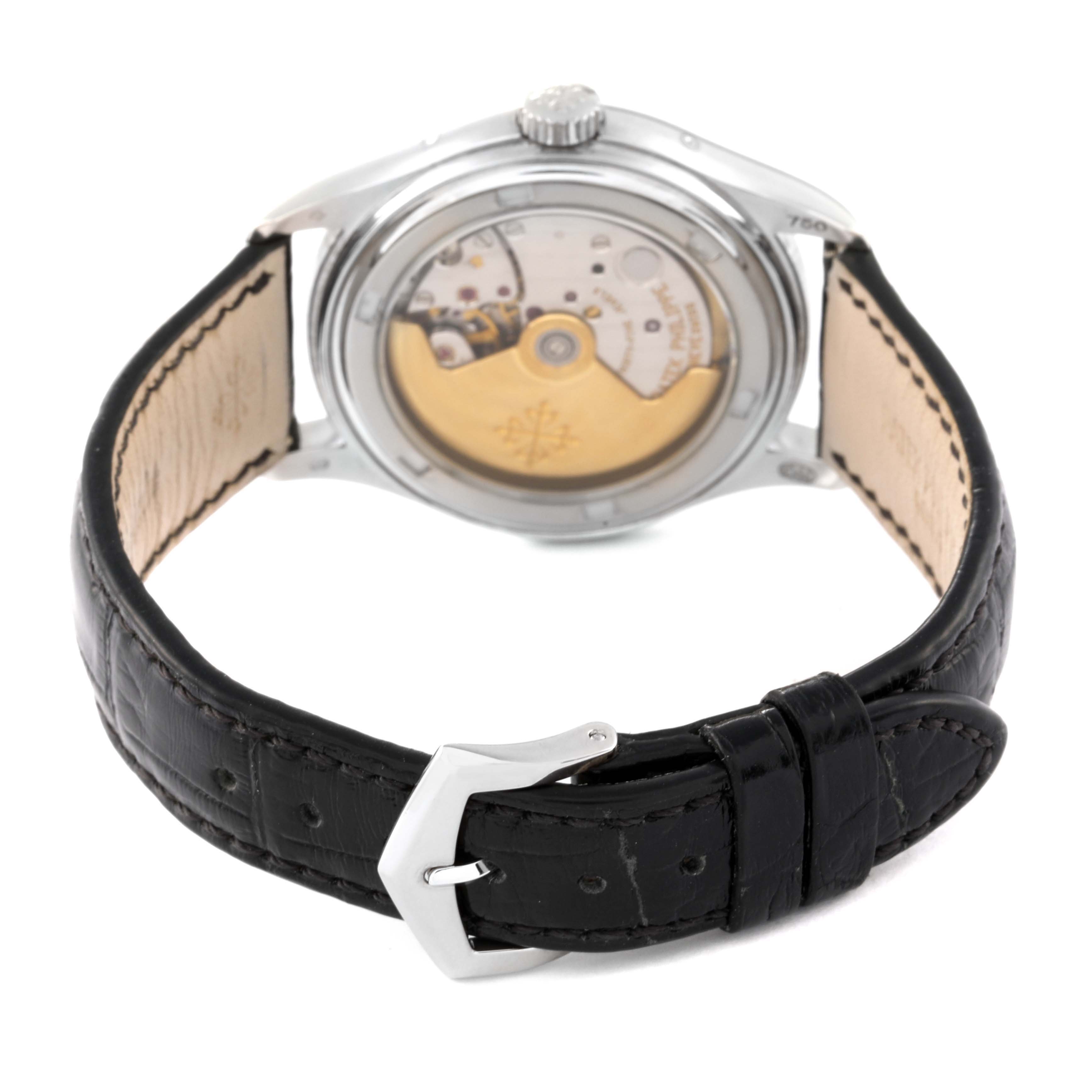 This image shows the back view of a Patek Philippe Complications 5035G Men's White Gold Black Dial 5035G Men's White Gold Black Dial model watch, highlighting its movement and black leather strap.