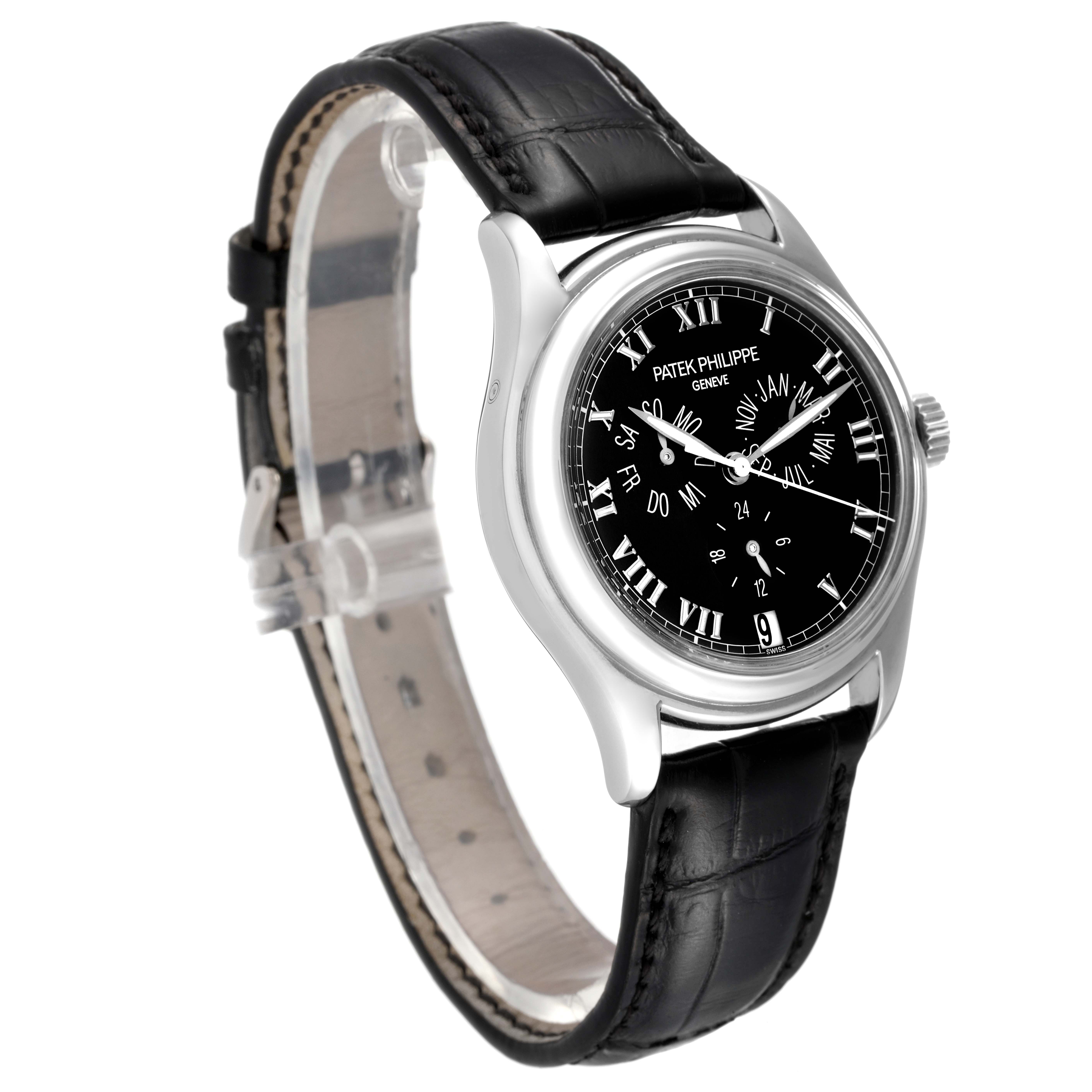 The image shows a Patek Philippe Complications 5035G Men's White Gold Black Dial 5035G Men's White Gold Black Dial watch at a three-quarter angle, highlighting the black dial, silver casing, and black leather strap.