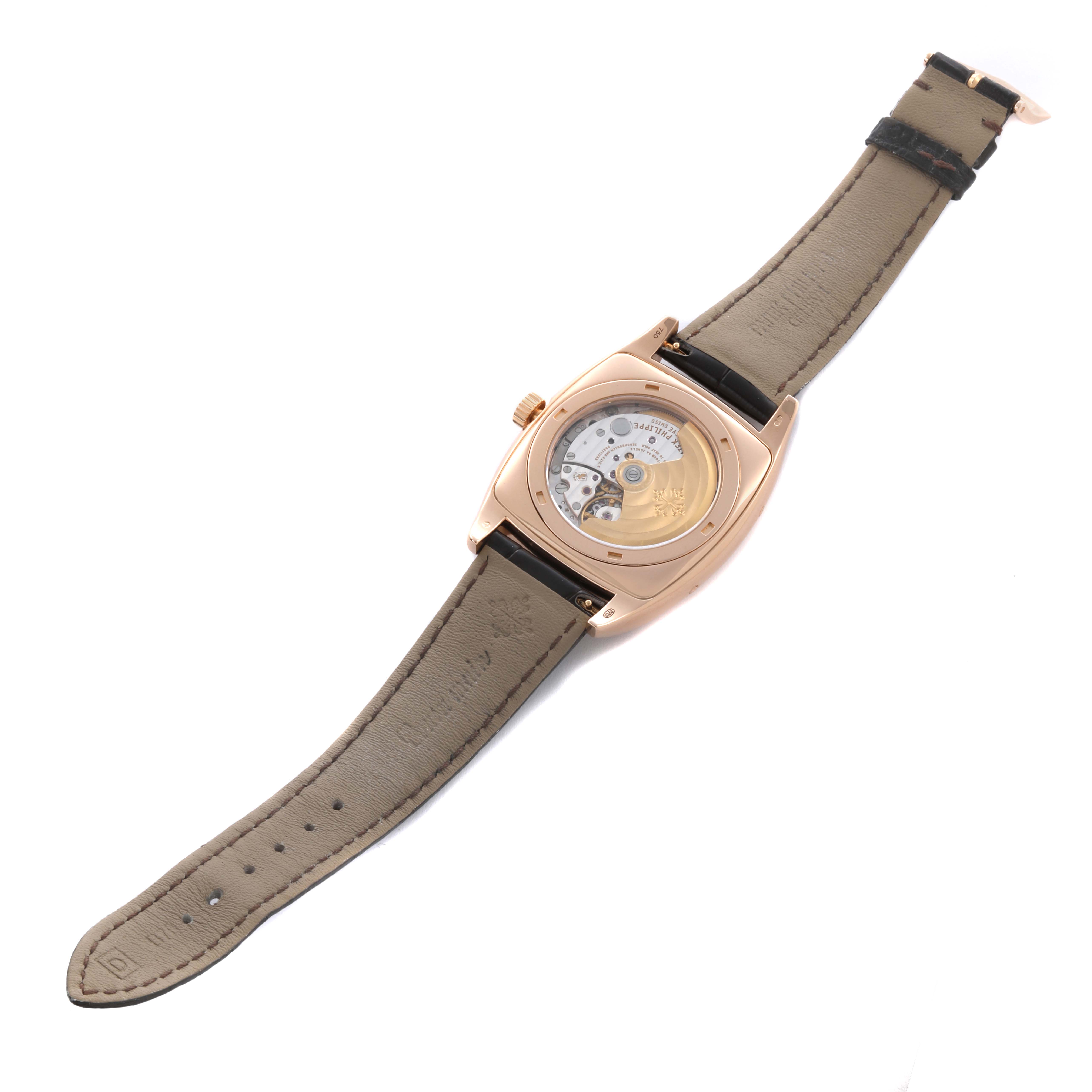 The image shows the back view of a Patek Philippe Gondolo 5135R-001 Men's Rose Gold Silver Dial 5135R-001 Men's Rose Gold Silver Dial watch, displaying its movement and leather strap.