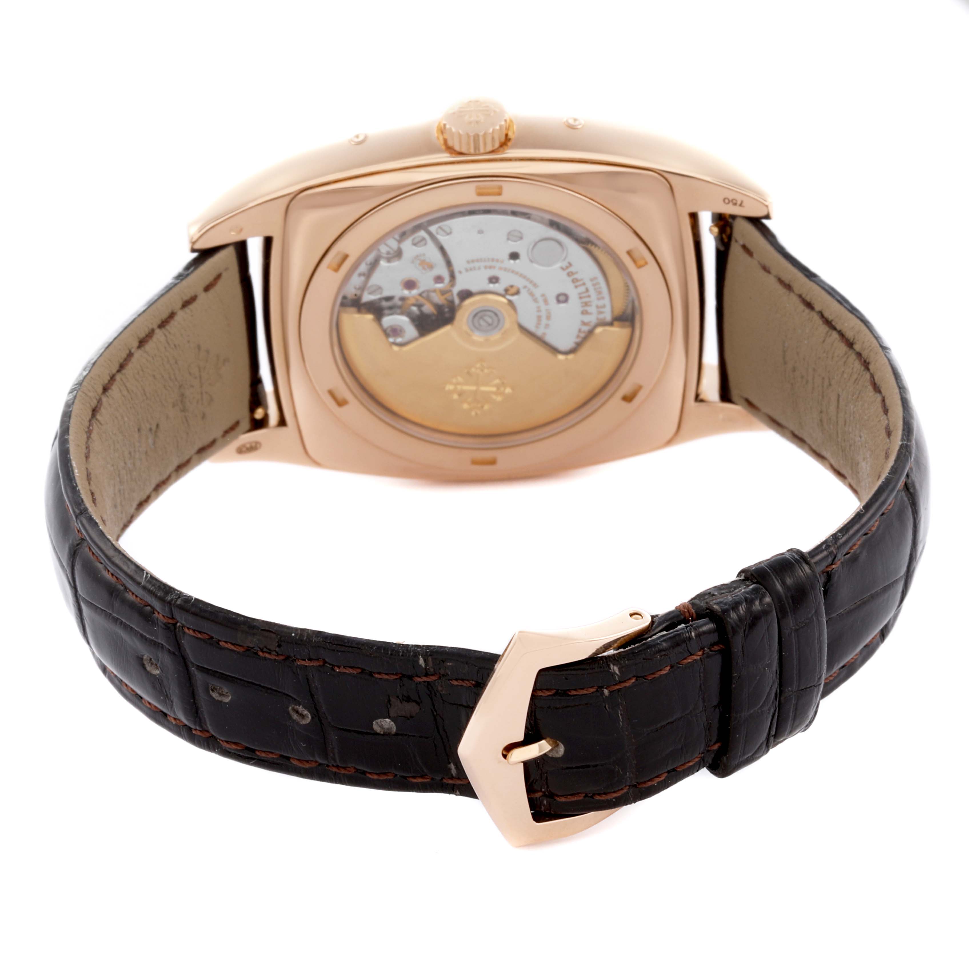 The image shows the back angle of a Patek Philippe Gondolo 5135R-001 Men's Rose Gold Silver Dial 5135R-001 Men's Rose Gold Silver Dial watch, highlighting its movement and leather strap.