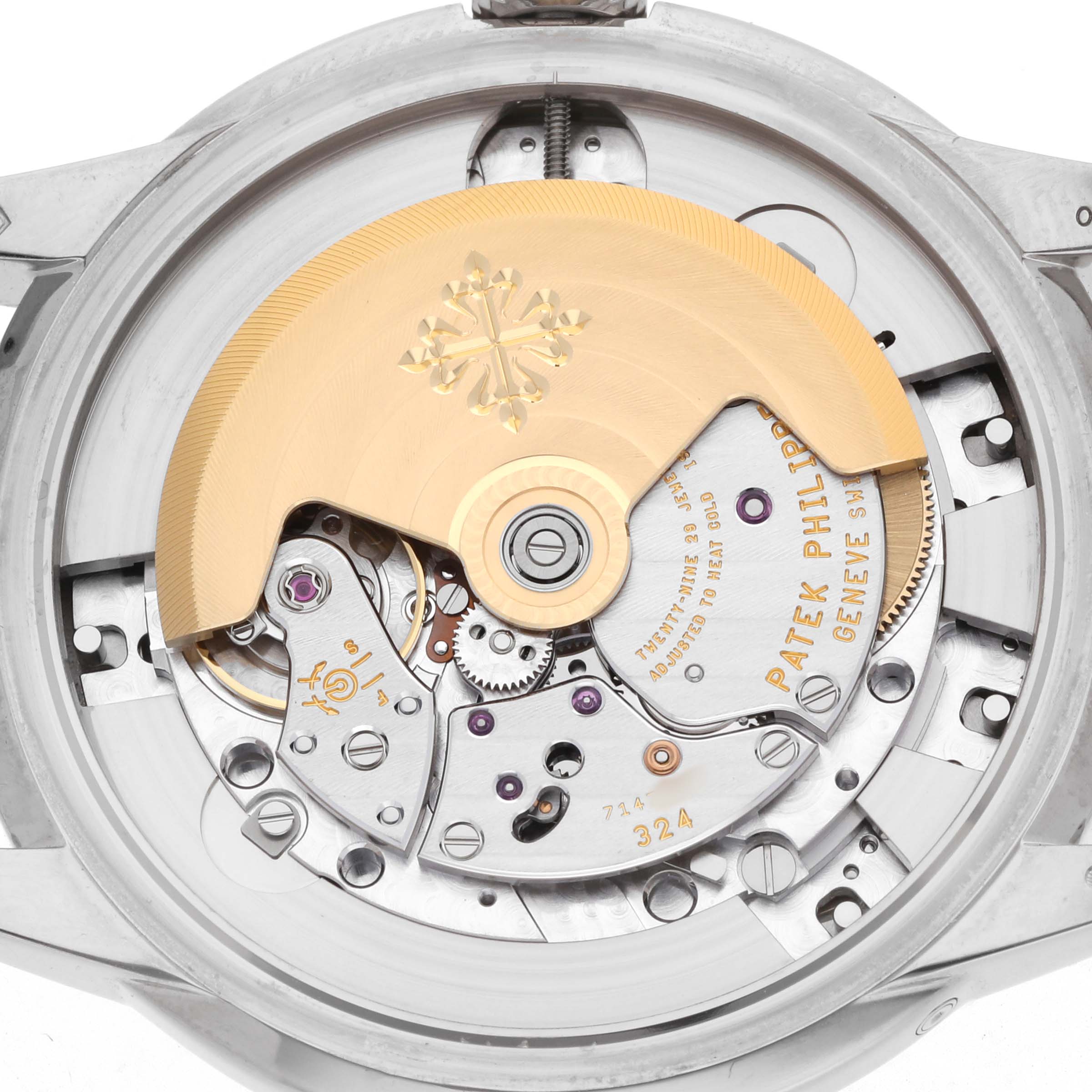 The image shows the back view of the Patek Philippe Complications 5320G Men's White Gold White Dial watch, highlighting its intricate movement and rotor.