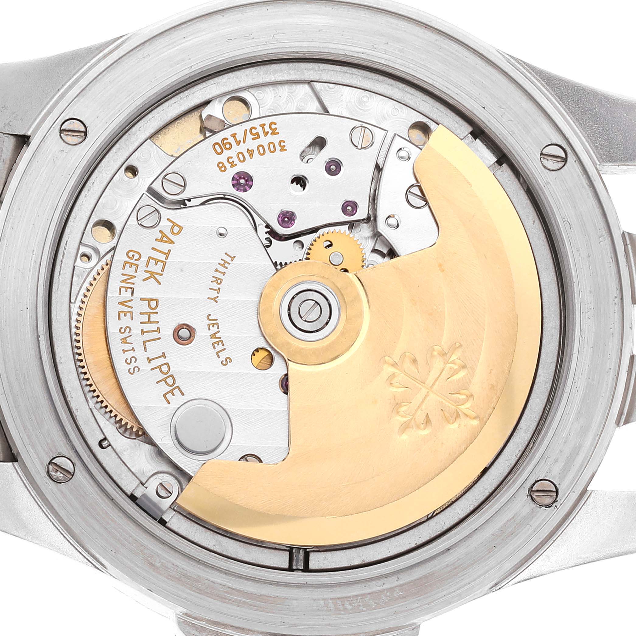 The image shows the back view of the Patek Philippe Neptune 5080/001 Men's Stainless Steel Pink Dial 5080/001 Men's Stainless Steel Pink Dial model, revealing its internal mechanical movement.