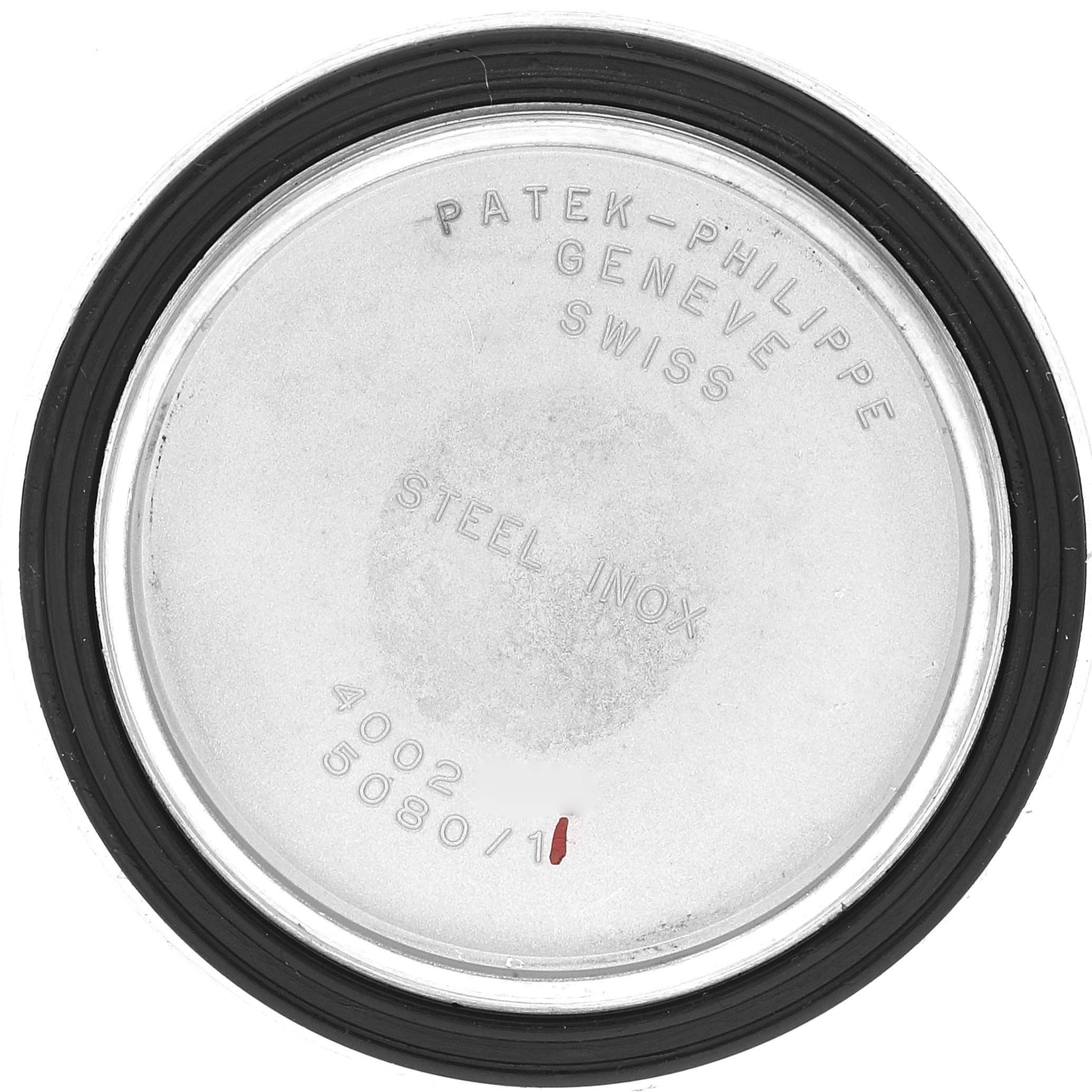 The image shows the case back of a Neptune model by Patek Philippe, displaying inscriptions and specifications.