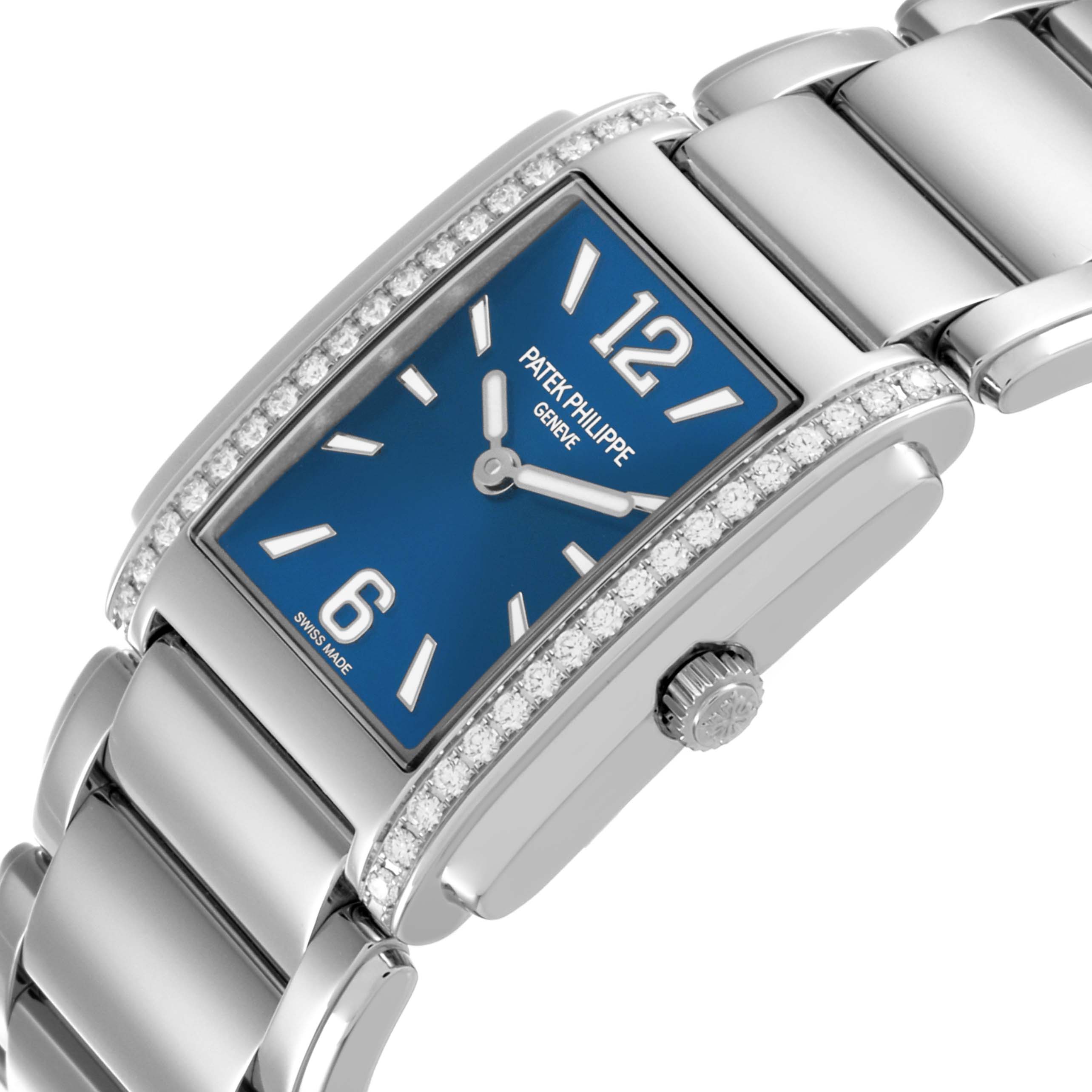 The image shows a side angle of a Patek Philippe Twenty-4 4910/1200A-001 Women's Stainless Steel Blue Dial 4910/1200A-001 Women's Stainless Steel Blue Dial watch, highlighting the rectangular case, blue dial, crown, and diamond accents.