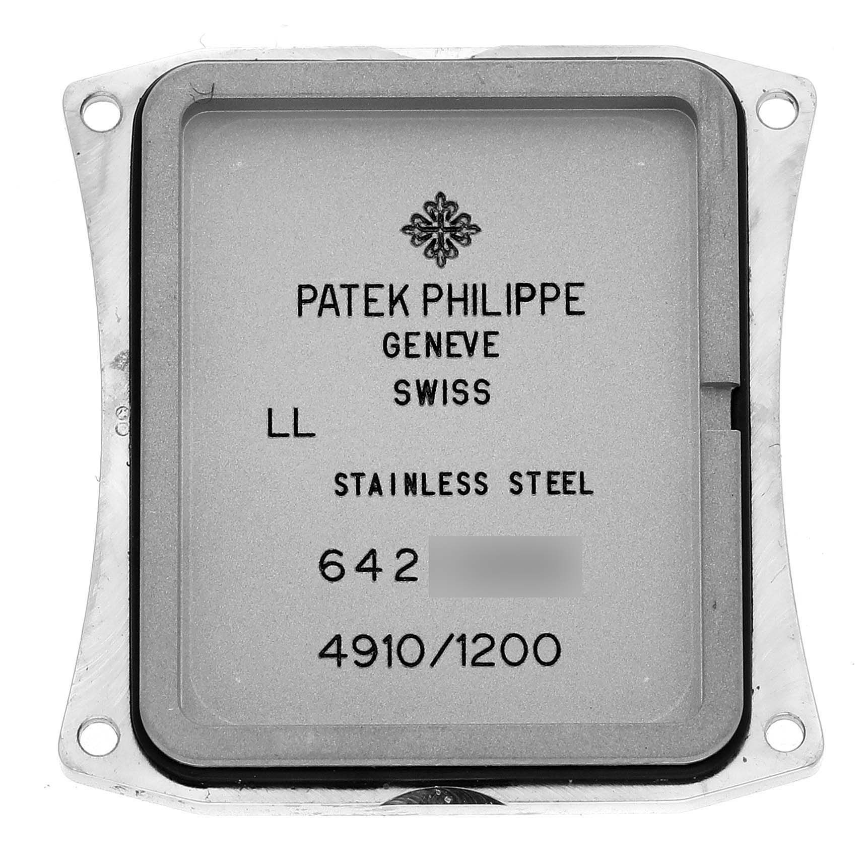 The image shows the back cover of a Patek Philippe Twenty-4 4910/1200A-001 Women's Stainless Steel Blue Dial 4910/1200A-001 Women's Stainless Steel Blue Dial watch, showing details like material and serial numbers.