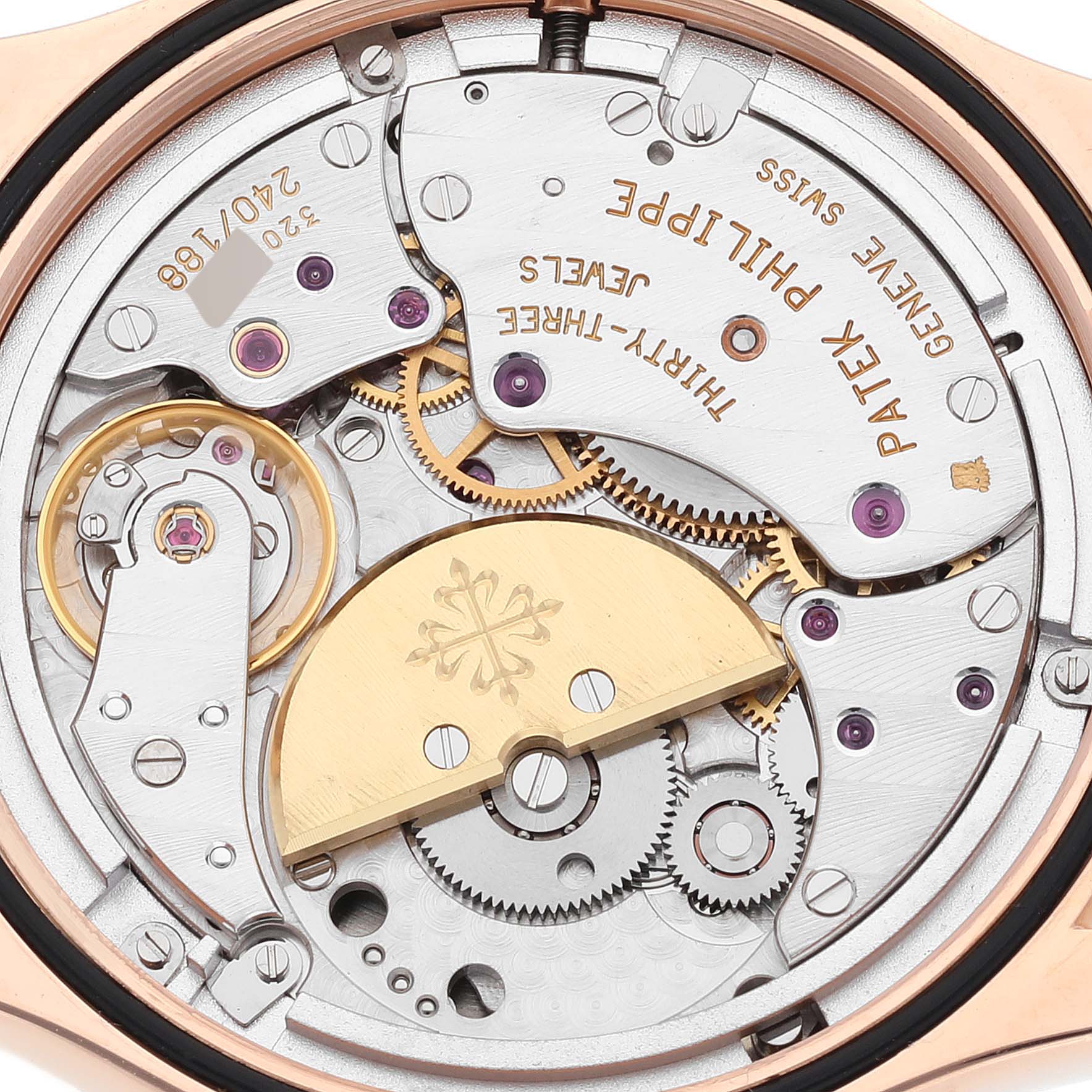 This image shows a close-up of the movement and intricate mechanisms inside a Patek Philippe Complications 5110R-001 Men
s Rose Gold Silver Dial 5110R-001 Men
s Rose Gold Silver Dial watch.