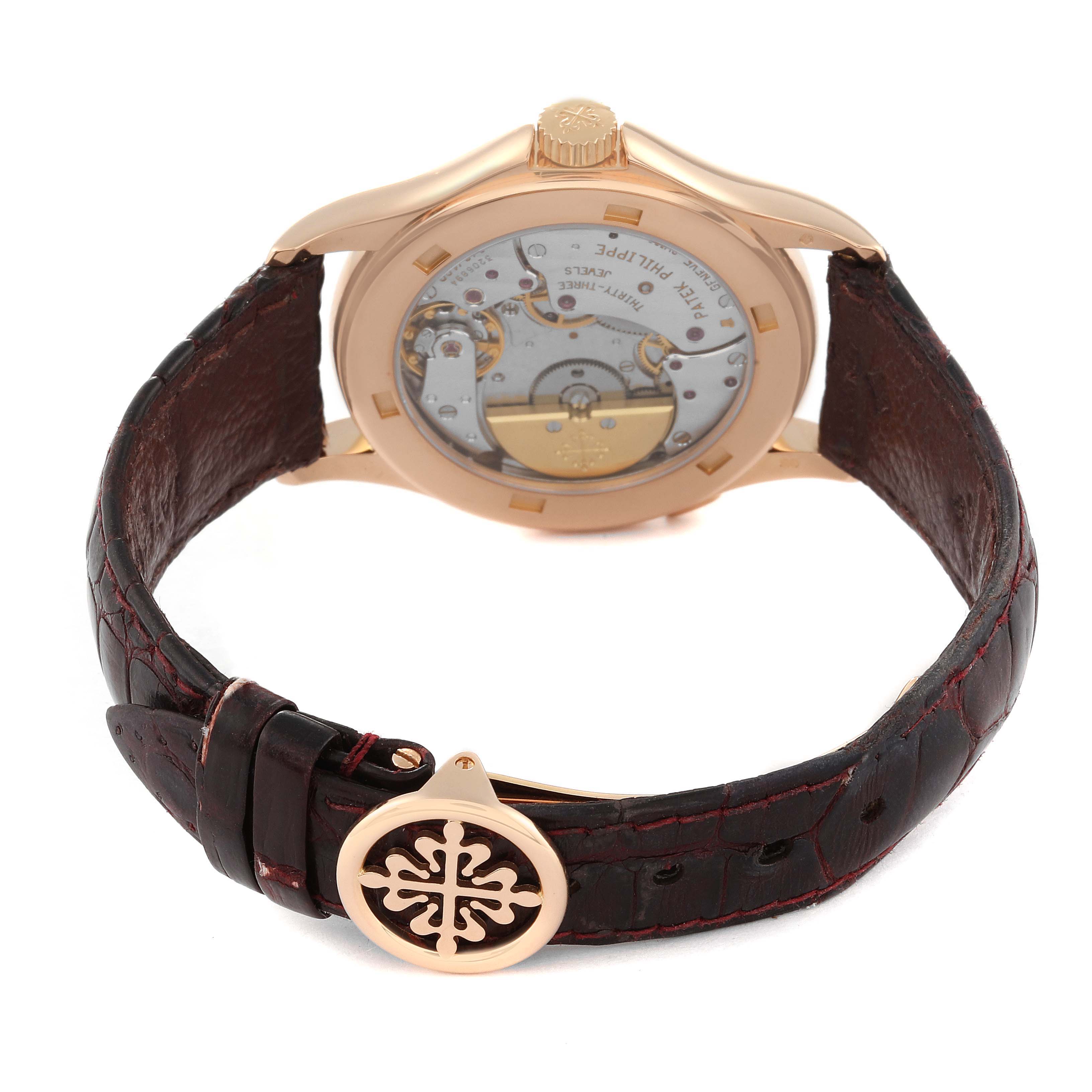 The image shows the back view of a Patek Philippe Complications 5110R-001 Men
s Rose Gold Silver Dial 5110R-001 Men
s Rose Gold Silver Dial model watch, highlighting the movement mechanism and leather strap.